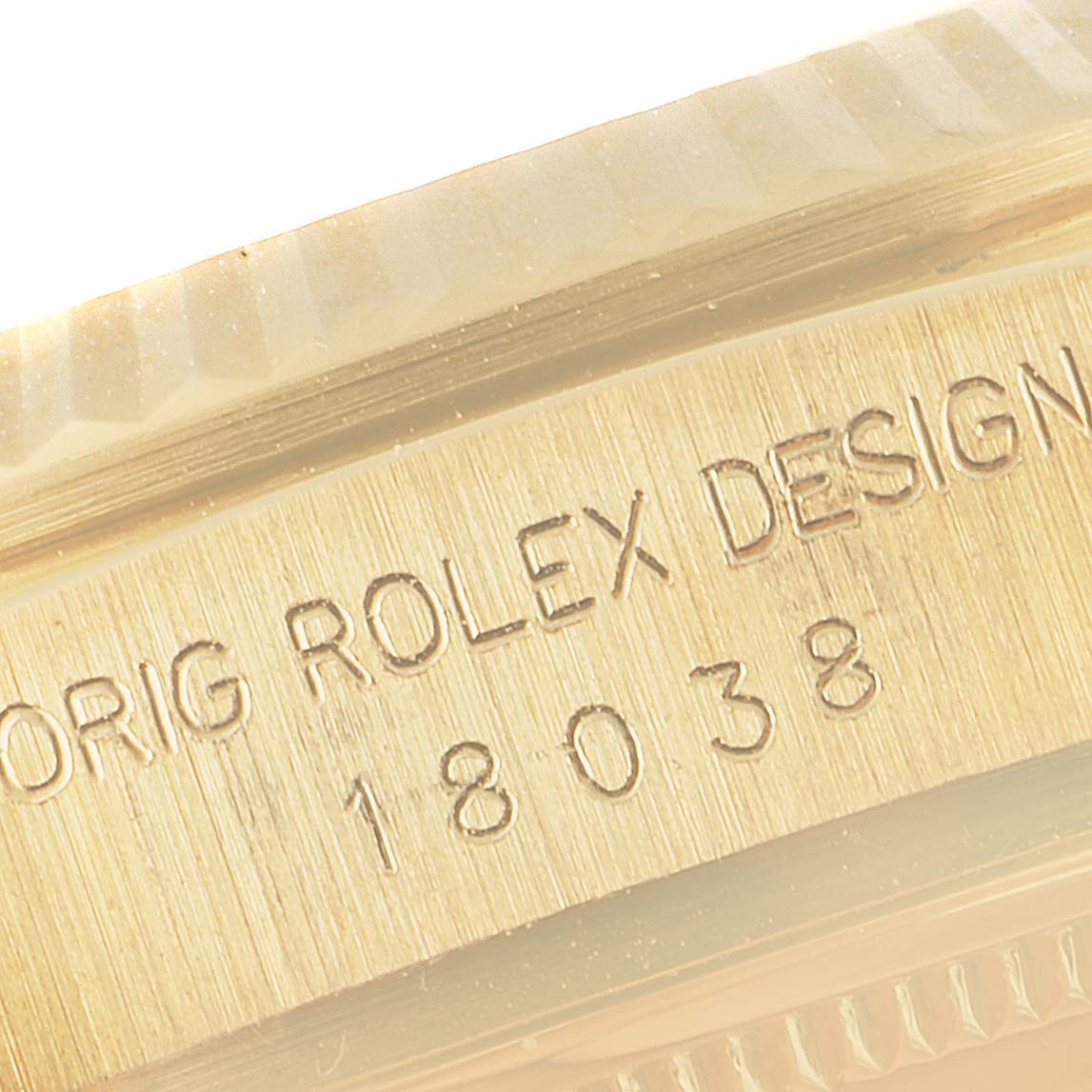This image shows a close-up of the serial number and engraving on the side of a Rolex President 18038 Men
s Yellow Gold Champagne Dial 18038 Men
s Yellow Gold Champagne Dial model watch case.