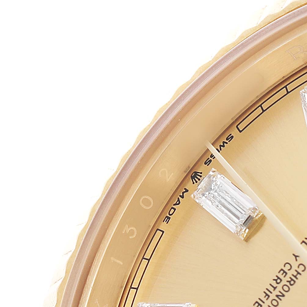 The image shows a close-up of the Rolex President 228238 Men's Yellow Gold Champagne Dial watch face, displaying part of the gold dial, diamond hour markers, and branding.