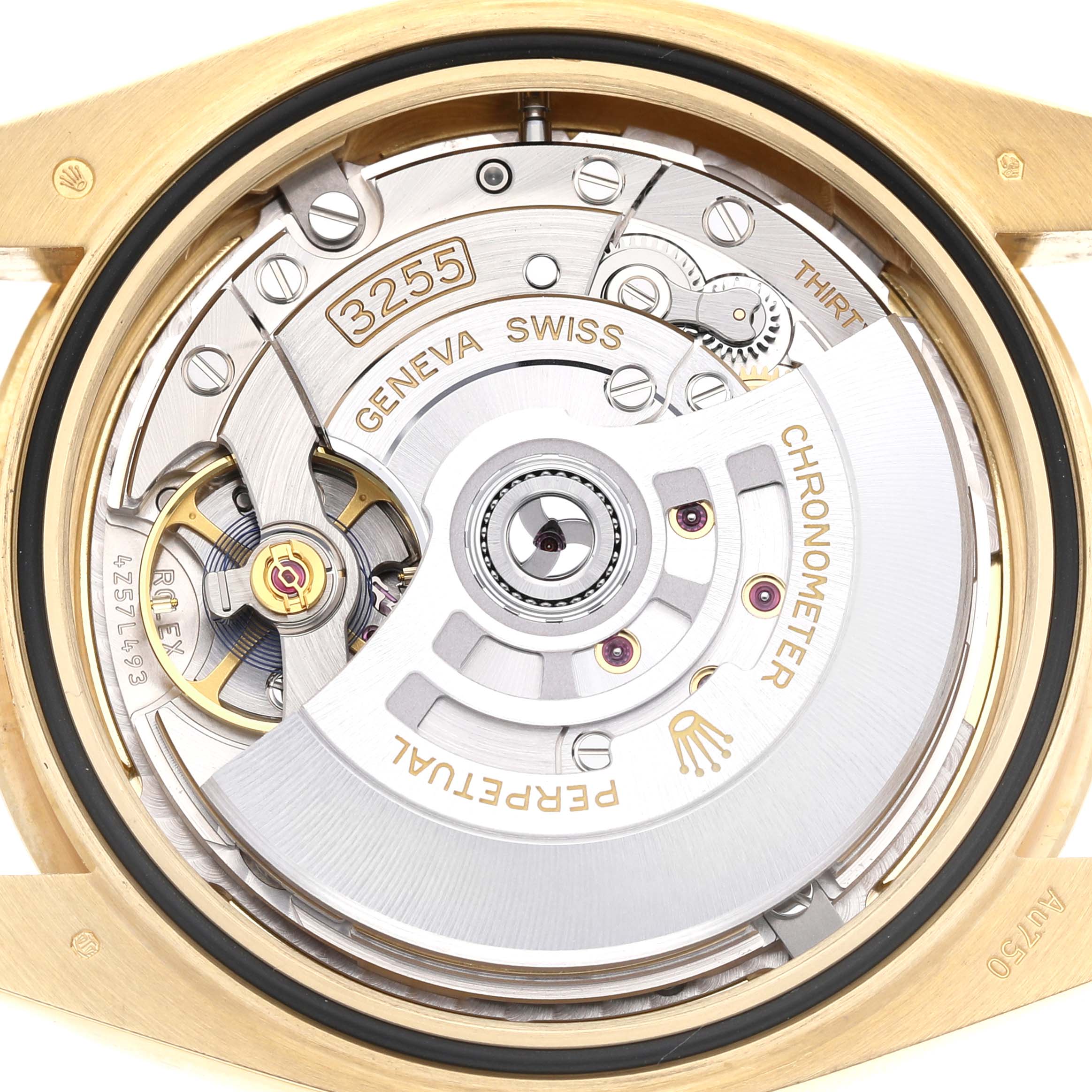 The image shows the movement of a Rolex President 228238 Men's Yellow Gold Champagne Dial watch, displaying intricate mechanical components from a top-down angle.
