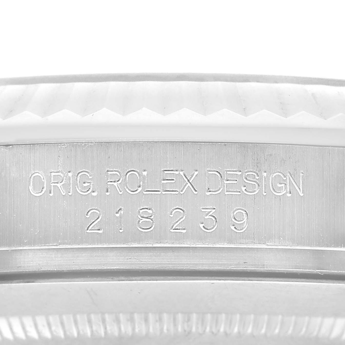 The image shows the inner case side engraving of a Rolex President 218239 Men's White Gold Silver Dial watch, featuring the brand name and model number.