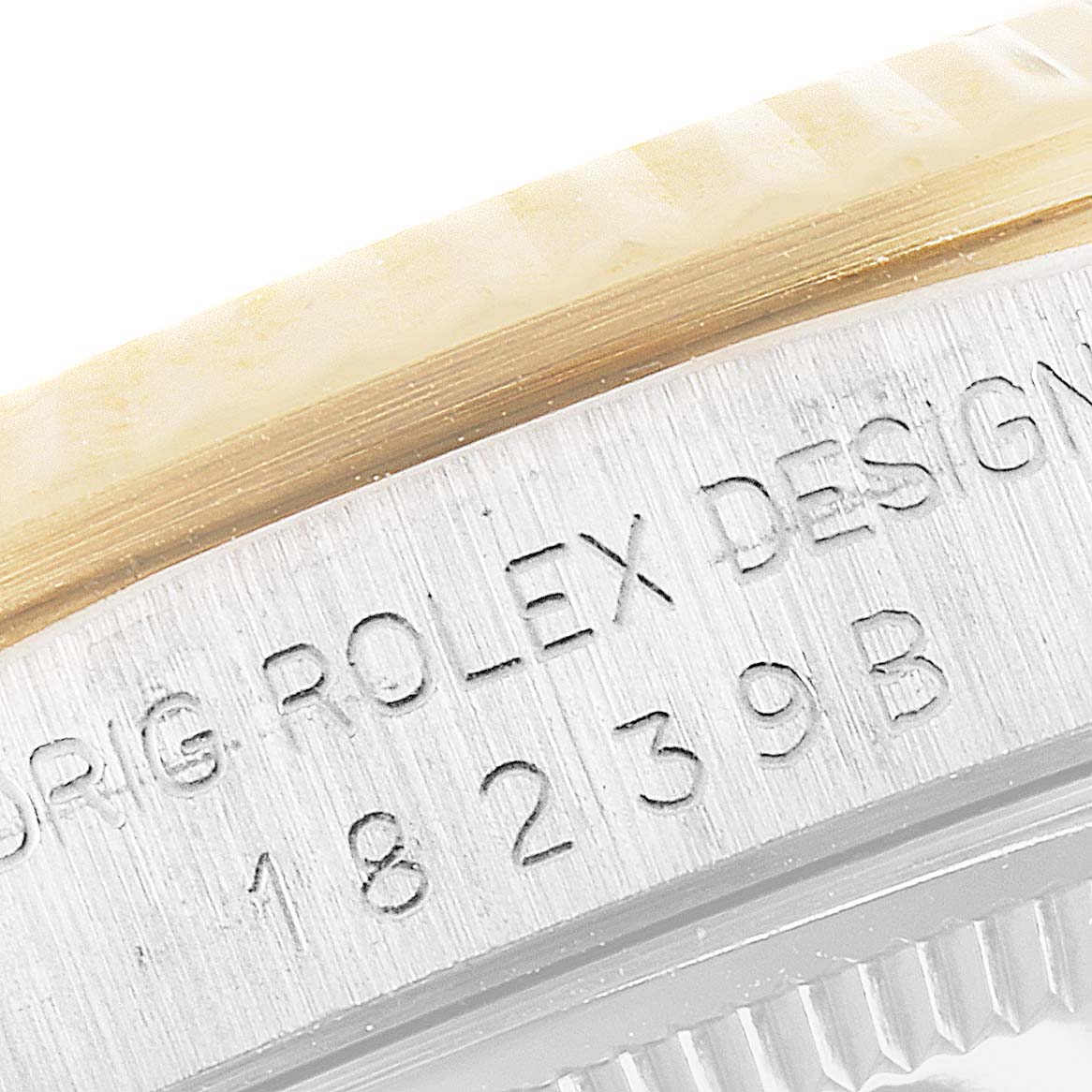 The image shows a close-up of the side of a Rolex President 18239 Men
s White Gold Brown Dial 18239 Men
s White Gold Brown Dial model, displaying the engraved model number.
