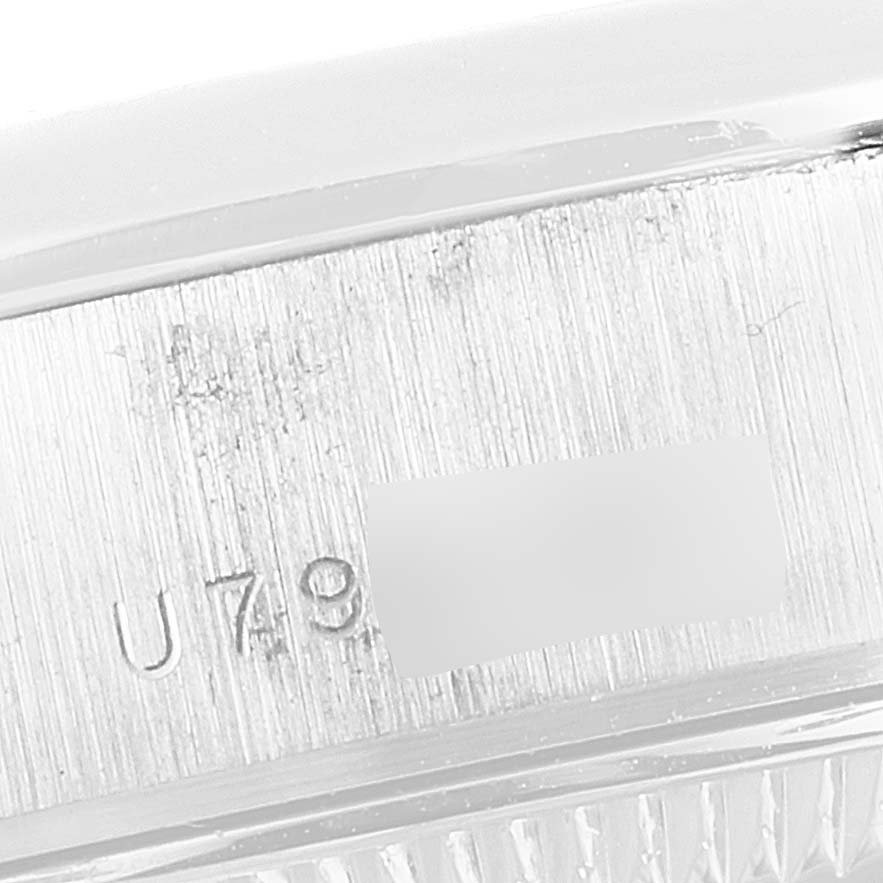 This image shows a close-up of the serial number engraving on the case side of a Rolex President 79166 Women's Platinum Silver Dial 79166 Women's Platinum Silver Dial model watch.
