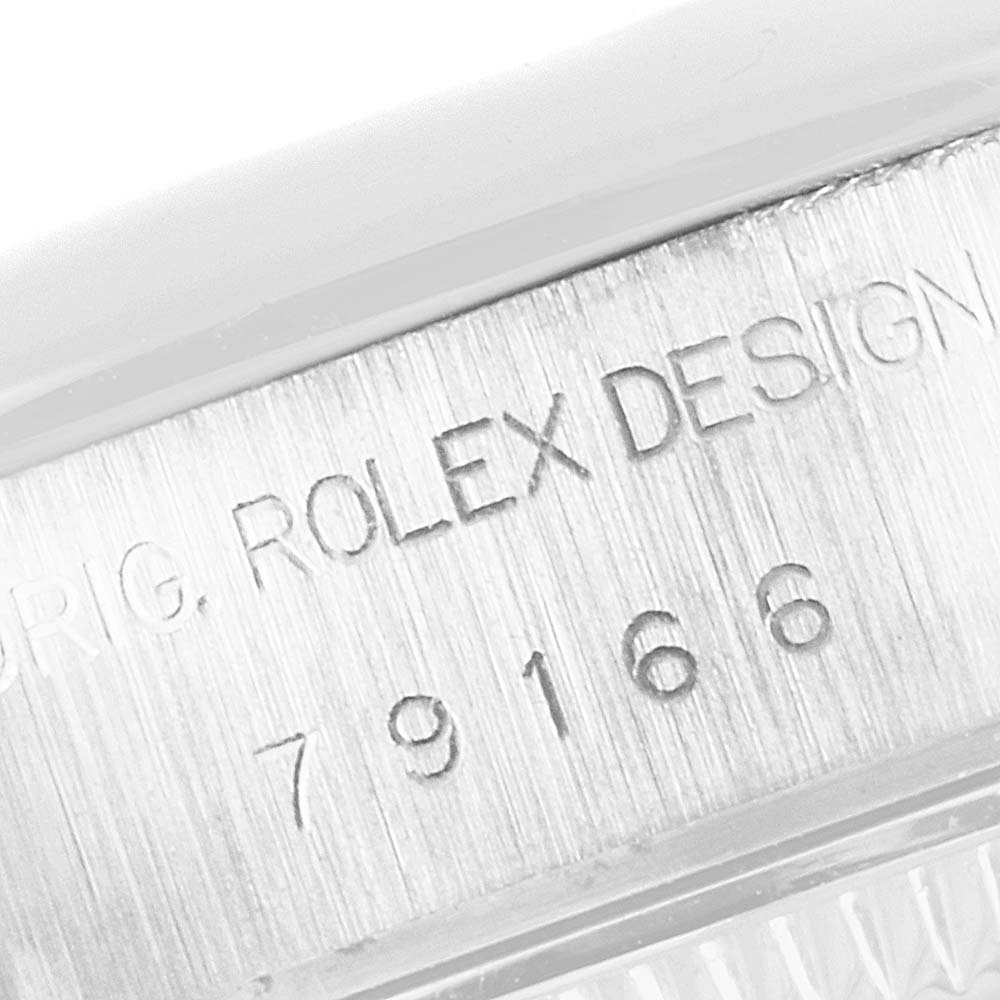 The image shows a close-up of the side of a Rolex President 79166 Women's Platinum Silver Dial 79166 Women's Platinum Silver Dial watch, focusing on the engraved model number and "Rolex Design" text.