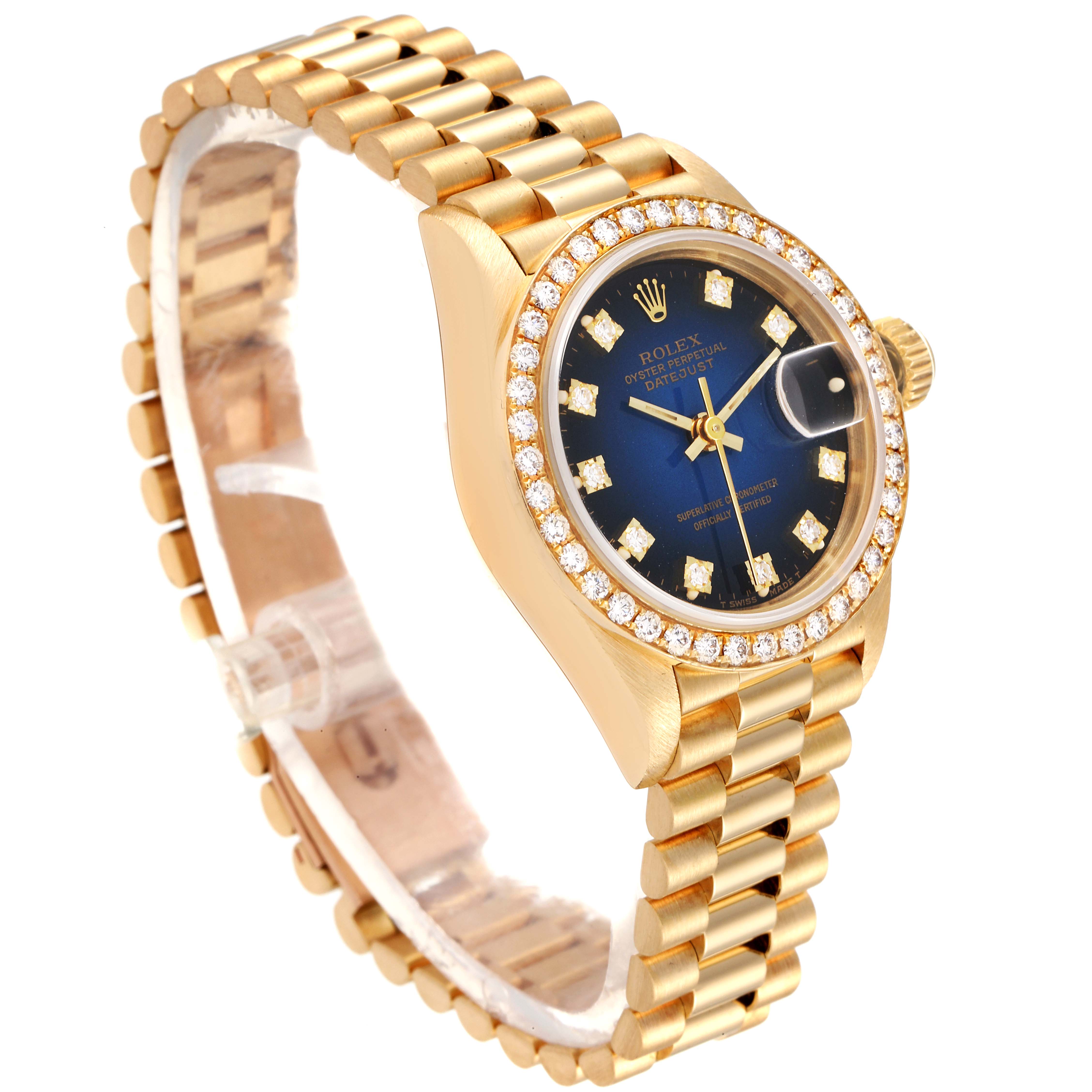 The image shows a Rolex President 69138 Women's Yellow Gold Blue Dial 69138 Women's Yellow Gold Blue Dial model watch at a three-quarter angle, highlighting the gold bracelet, blue dial, and diamond-encrusted bezel.