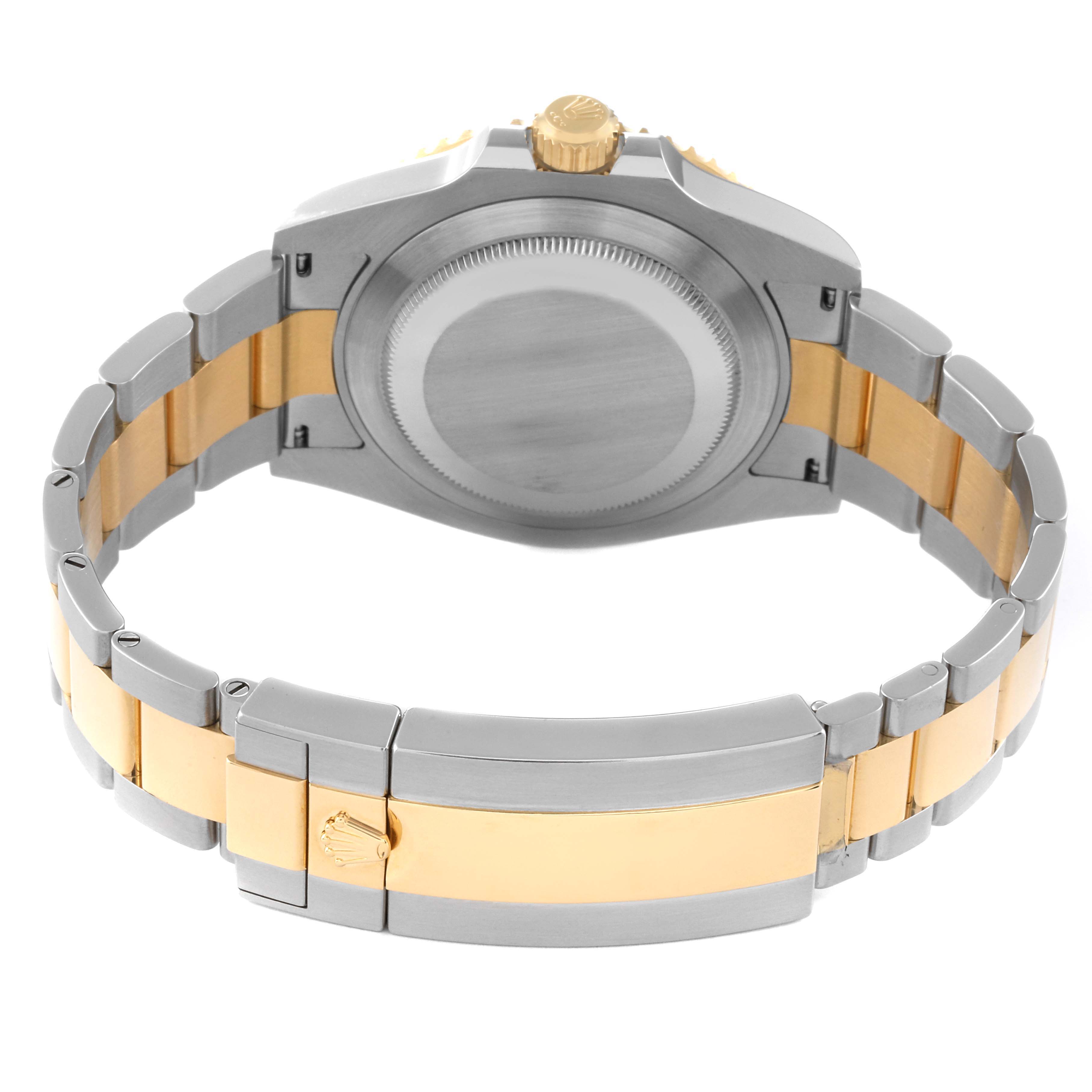 The image shows the back and bracelet of a Rolex Submariner 126613 Men's Steel and Gold (two tone) Black Dial 126613 Men's Steel and Gold (two tone) Black Dial watch, emphasizing its two-tone metal design.