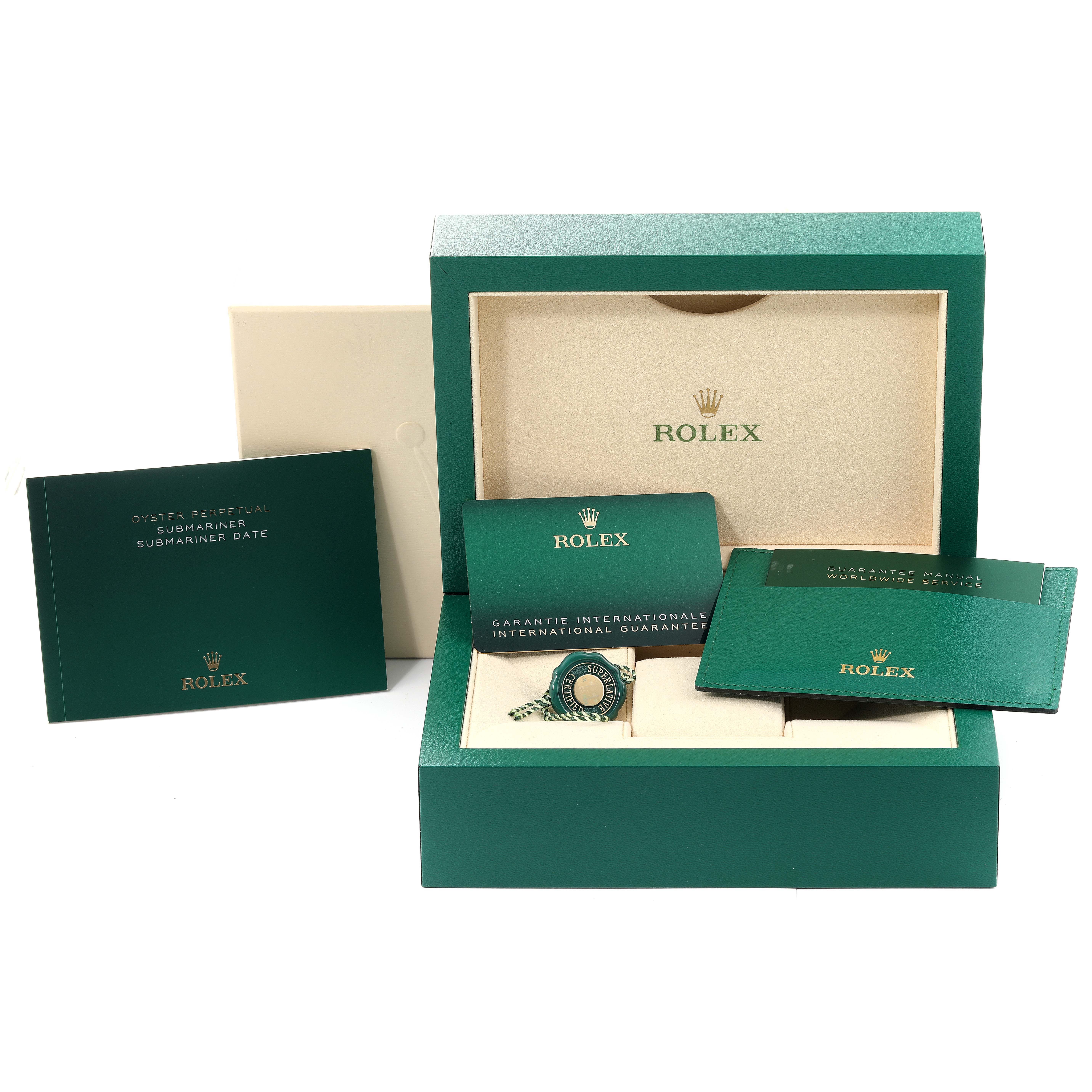 This image shows the packaging and accessories of a Rolex Submariner 126613 Men's Steel and Gold (two tone) Blue Dial 126613 Men's Steel and Gold (two tone) Blue Dial, including the box, manuals, and warranty card.