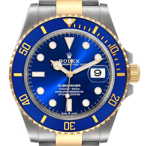 The image shows a frontal view of a Rolex Submariner watch, highlighting the blue dial, bezel, and stainless steel and gold band.