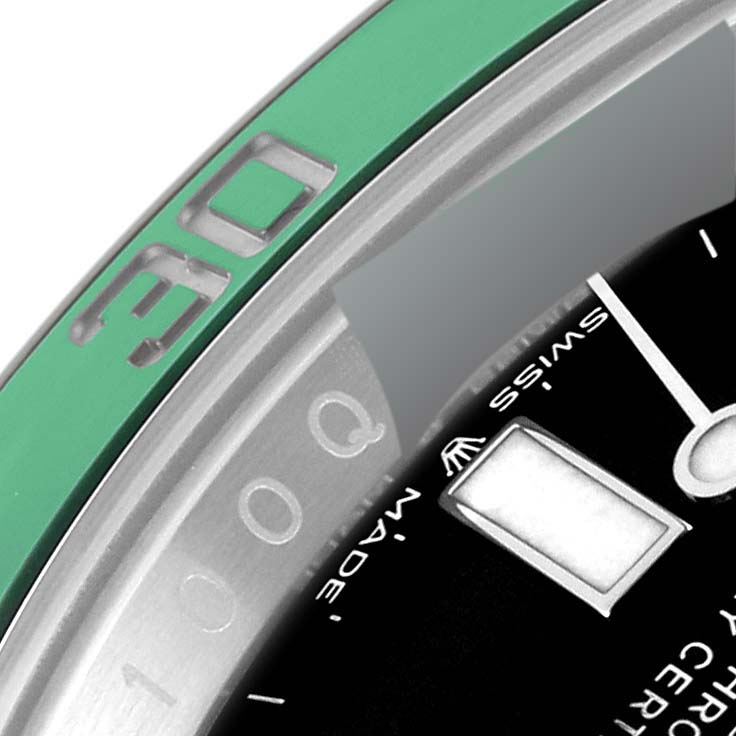 The image shows a close-up of the bezel and part of the dial of a Rolex Submariner 126610LV Men
s Stainless Steel Black Dial 126610LV Men
s Stainless Steel Black Dial watch, focusing on the 30-minute mark.