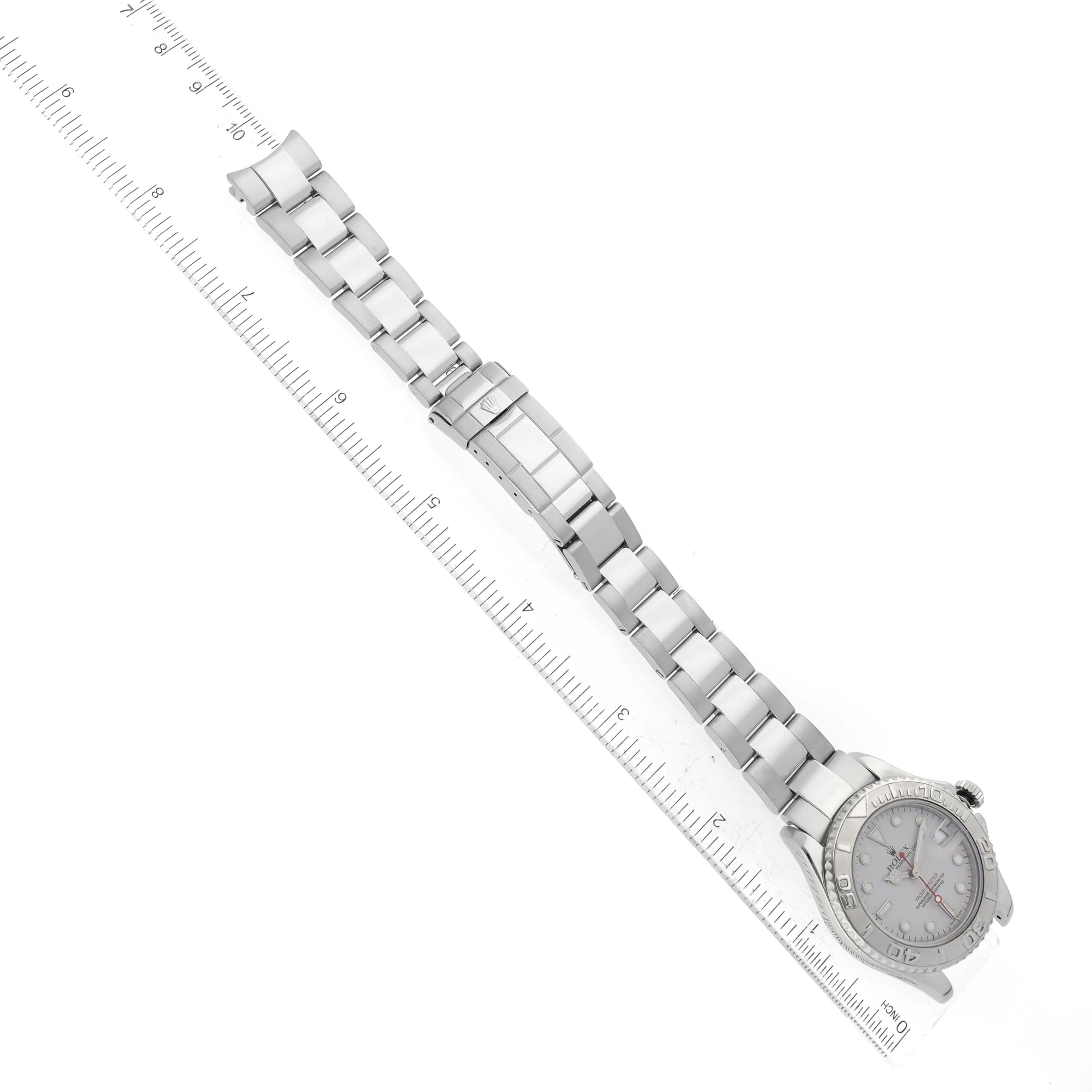 The image shows a Rolex Yacht-Master 168622 Men's Stainless Steel Silver Dial 168622 Men's Stainless Steel Silver Dial watch laid flat with its silver bracelet fully extended next to a ruler for measurement.