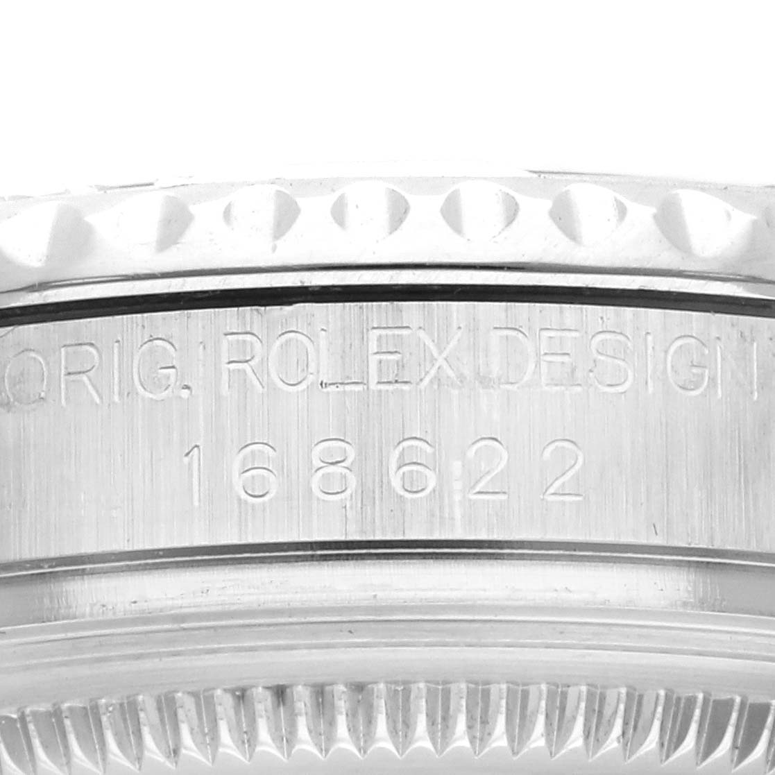 This is a close-up of the edge and serial number engraving on the Rolex Yacht-Master 168622 Men's Stainless Steel Silver Dial 168622 Men's Stainless Steel Silver Dial model.