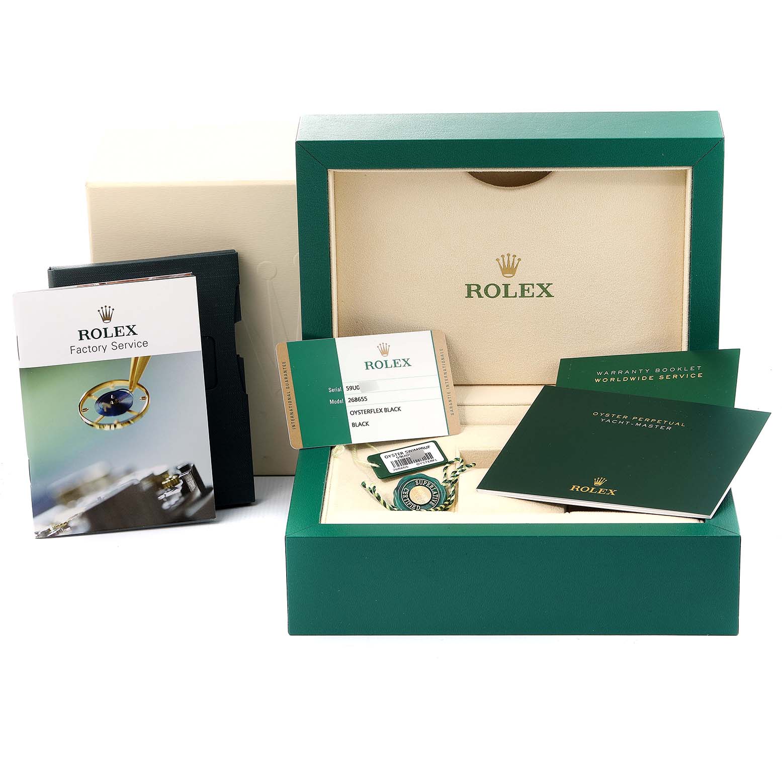 This image shows the packaging and accessories for a Rolex Yacht-Master 268655 Men's Rose Gold Black Dial 268655 Men's Rose Gold Black Dial, including the box, booklets, tags, and warranty card.