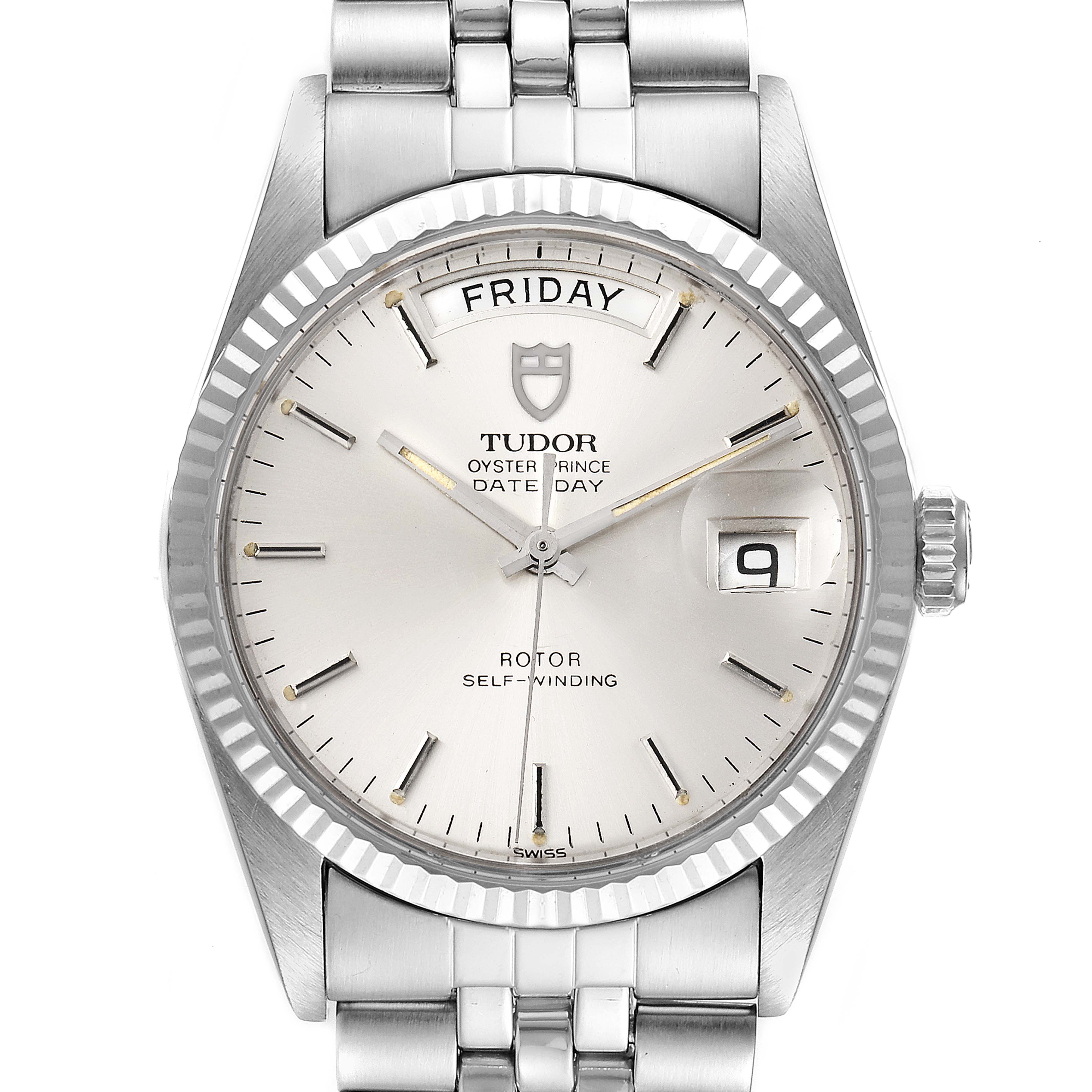The Tudor Prince 94614 Men's Stainless Steel Silver Dial 94614 Men's Stainless Steel Silver Dial watch is shown from a top-down angle, displaying the dial, date, and day features along with the bracelet.