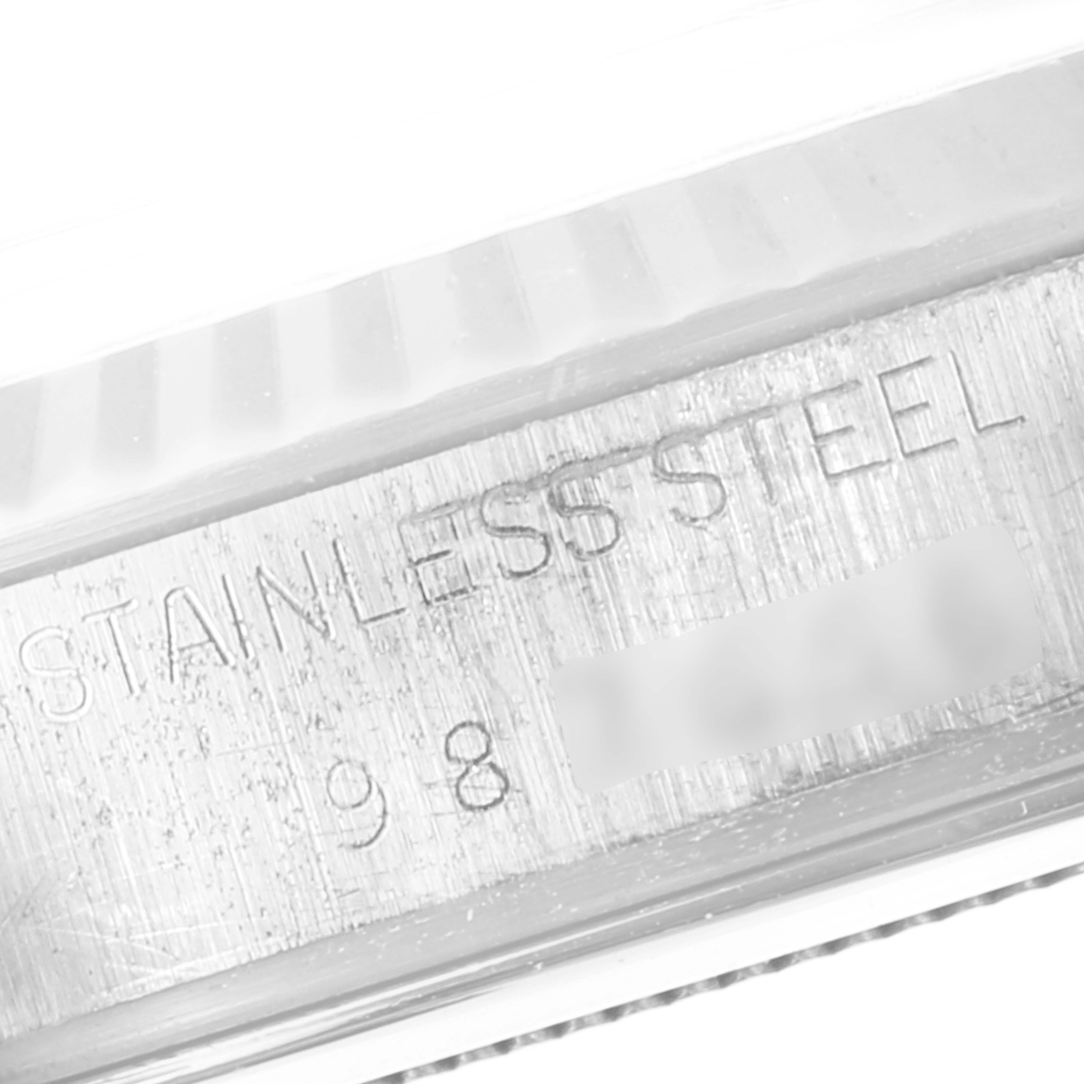 The image shows a close-up of the side of a Tudor Prince 94614 Men's Stainless Steel Silver Dial 94614 Men's Stainless Steel Silver Dial watch, highlighting "STAINLESS STEEL" engraving.