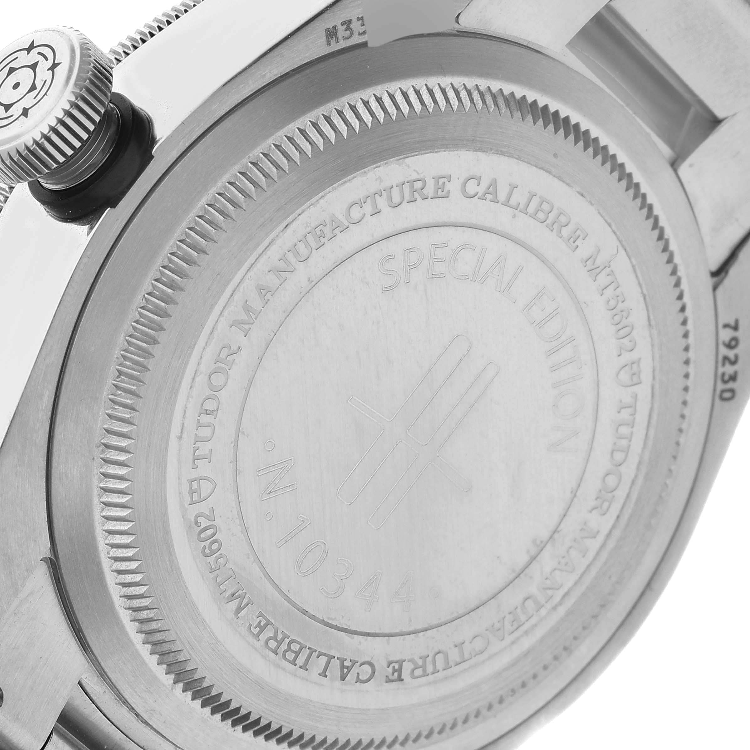 This image shows the case back of the Tudor Heritage Black Bay 79230G Men's Stainless Steel Black Dial 79230G Men's Stainless Steel Black Dial watch, including the crown and part of the bracelet.