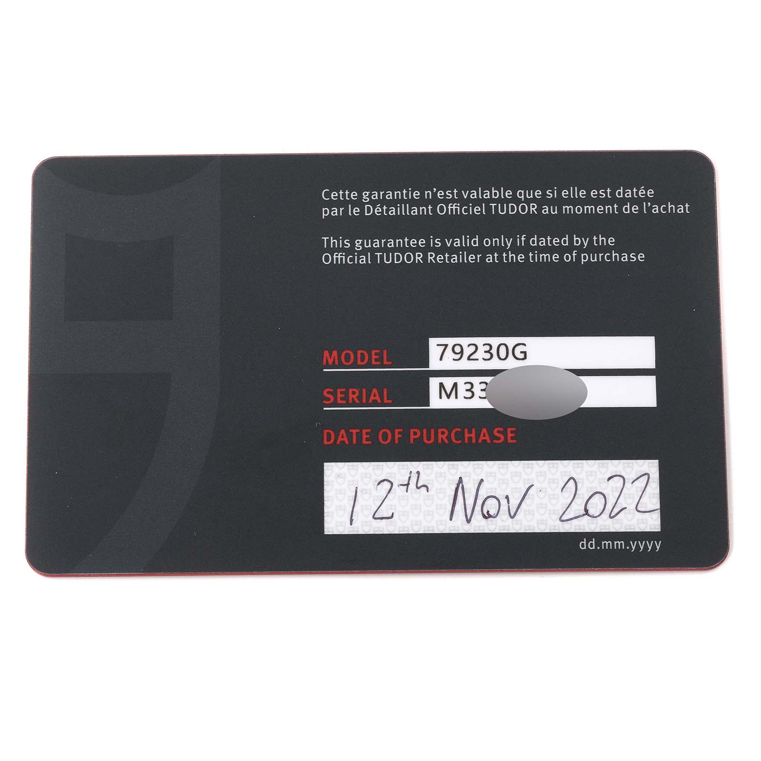 The image shows a warranty card for the Tudor Heritage Black Bay 79230G Men's Stainless Steel Black Dial 79230G Men's Stainless Steel Black Dial model 79230G, detailing the serial number and purchase date.