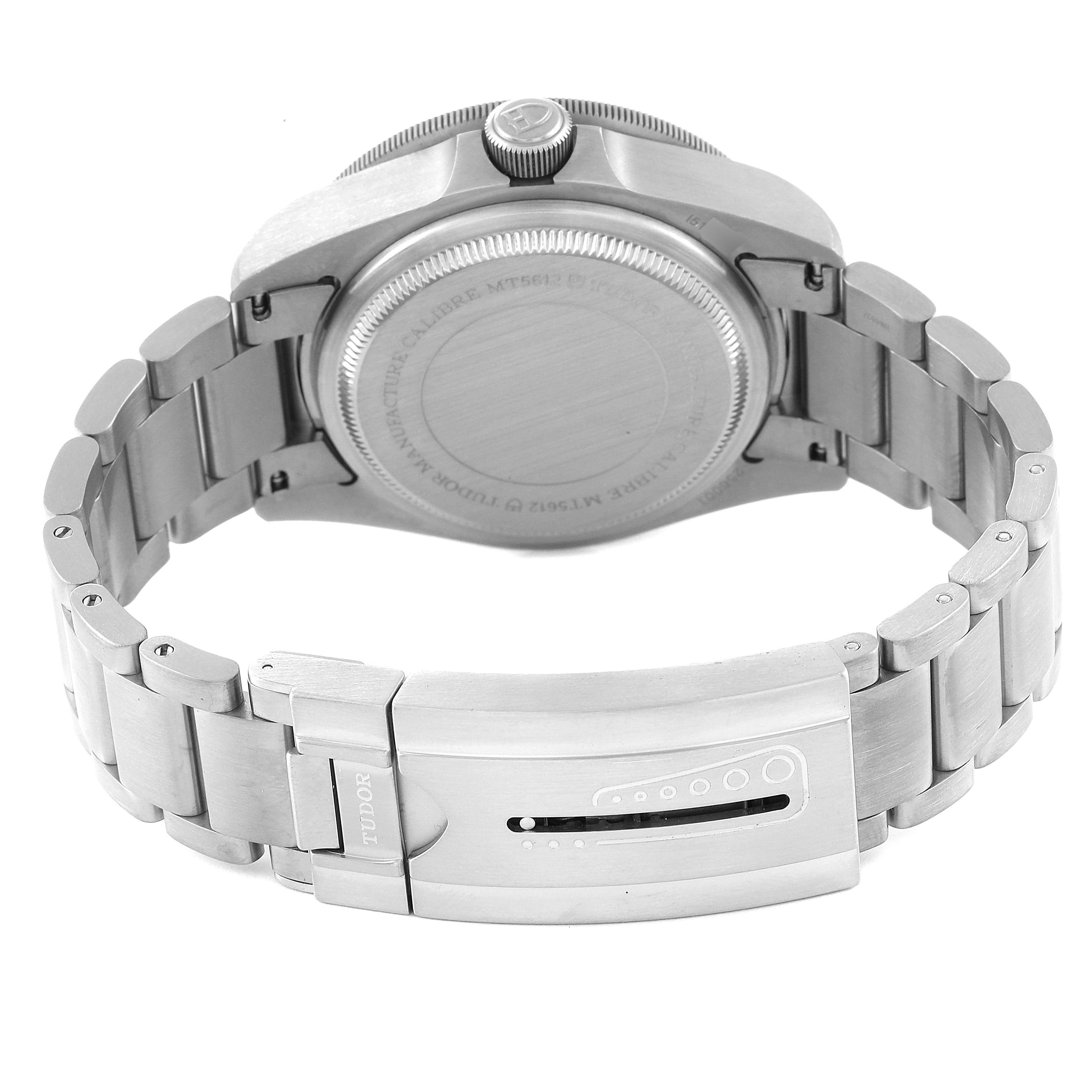 The Tudor Pelagos 25600TN Men's Titanium Black Dial 25600TN Men's Titanium Black Dial watch is shown from the back, highlighting its case back, crown, and stainless steel bracelet with the clasp visible.