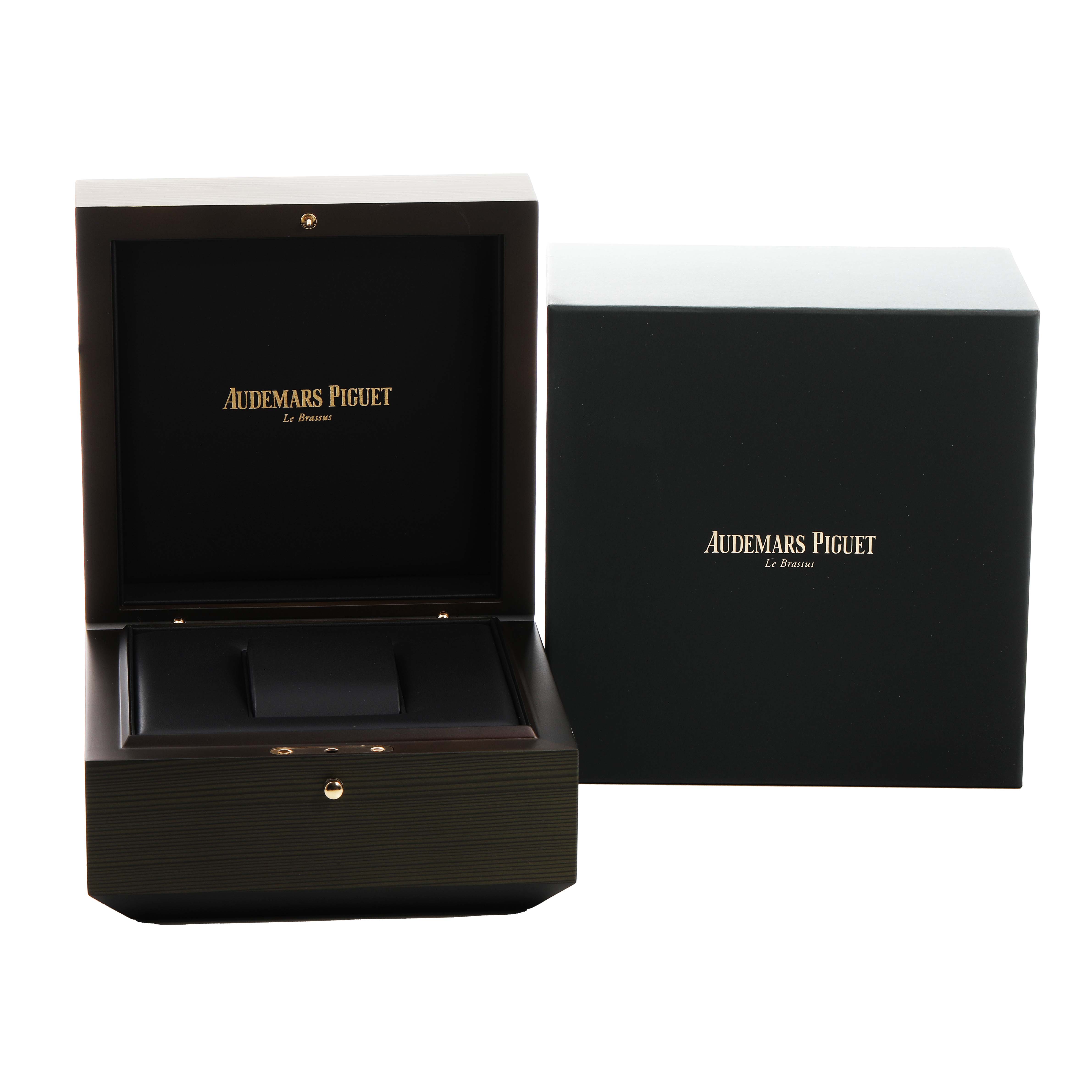 The image shows an Audemars Piguet Royal Oak Offshore 15706AU.OO.A002CA.01 Men's Titanium Black Dial watch box and its outer packaging.
