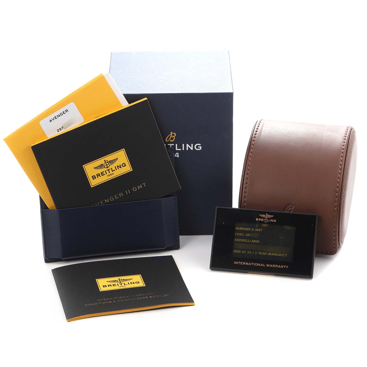 The image shows the Breitling Avenger A32390 Men
s Stainless Steel Mother of Pearl Dial watch packaging, manuals, a warranty card, and a brown leather case.