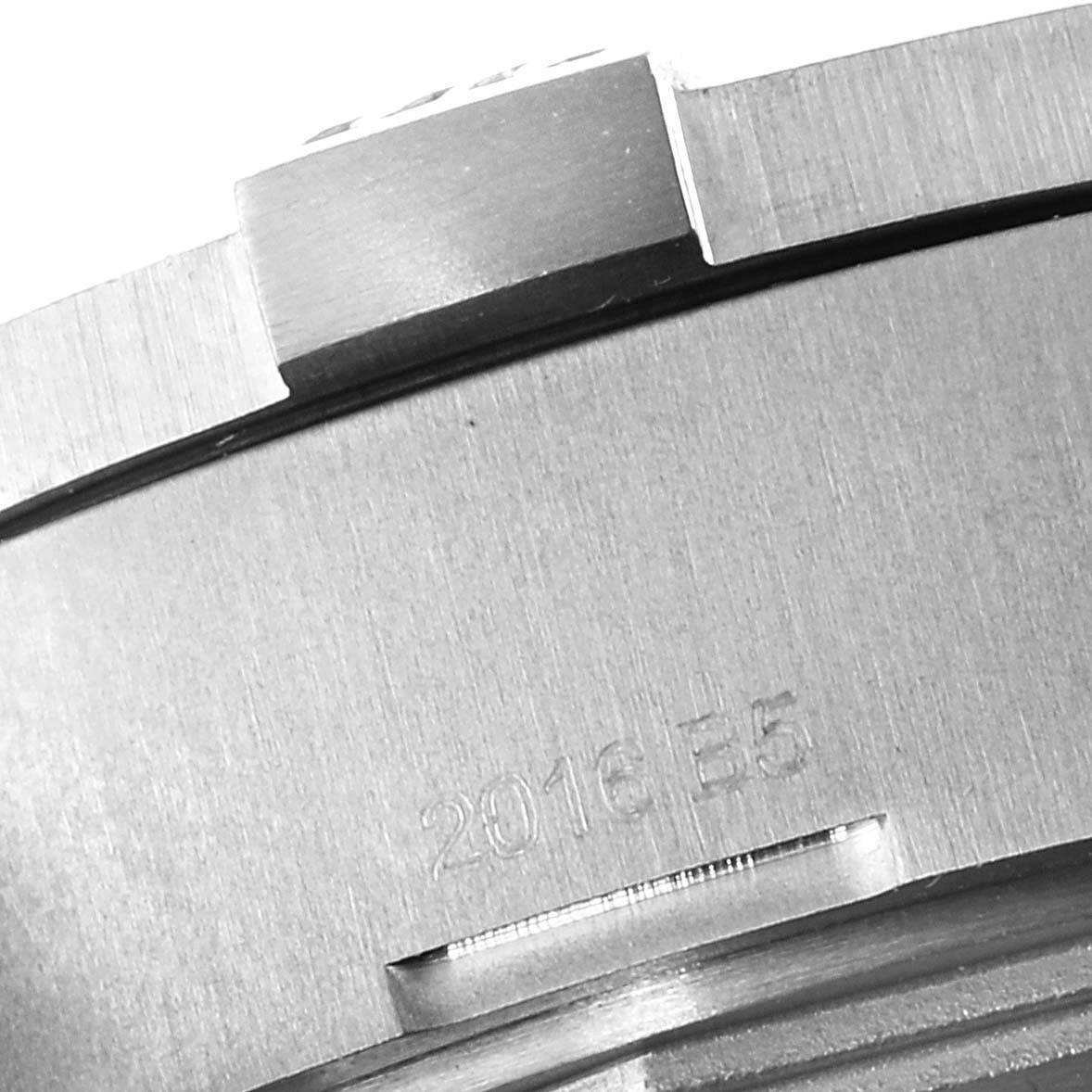 This image shows an angled view of the case back and part of the bezel on a Breitling Avenger E1338310/M536-109W Men's Titanium Grey Dial E1338310/M536-109W Men's Titanium Grey Dial watch, with some engraved text.