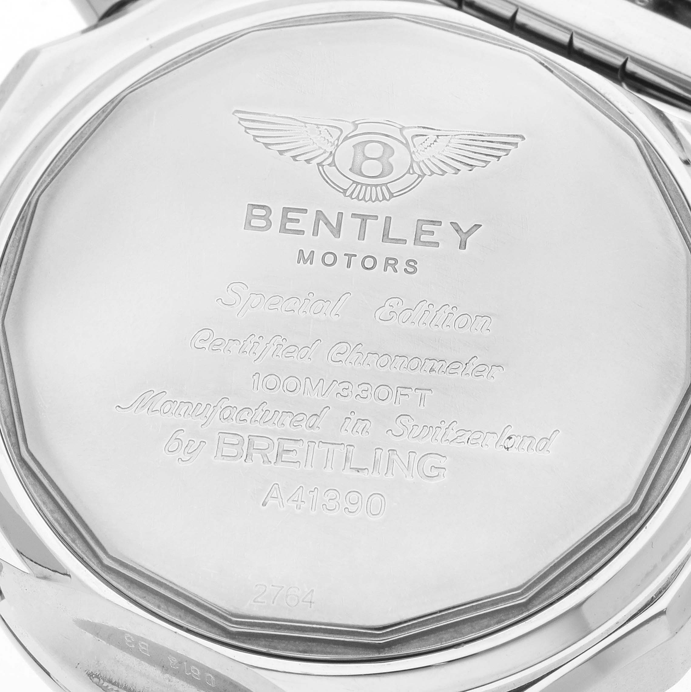 The image shows the back casing of a Breitling Bentley A41390 Men
s Stainless Steel Black Dial watch, featuring engraved details and logos.
