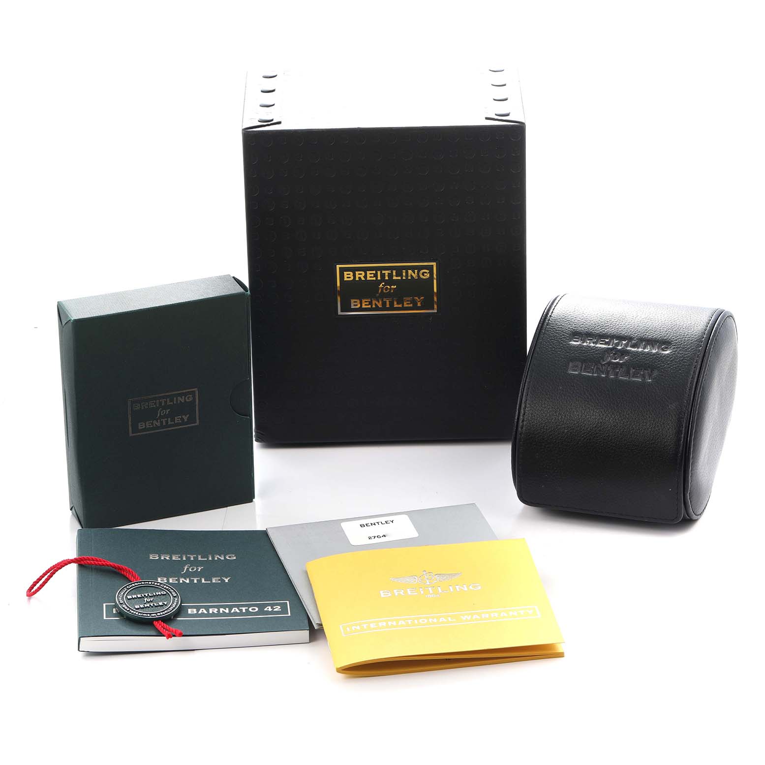 The image shows packaging and accessories for a Breitling Bentley A41390 Men
s Stainless Steel Black Dial watch, including boxes, a leather case, manuals, and a tag.