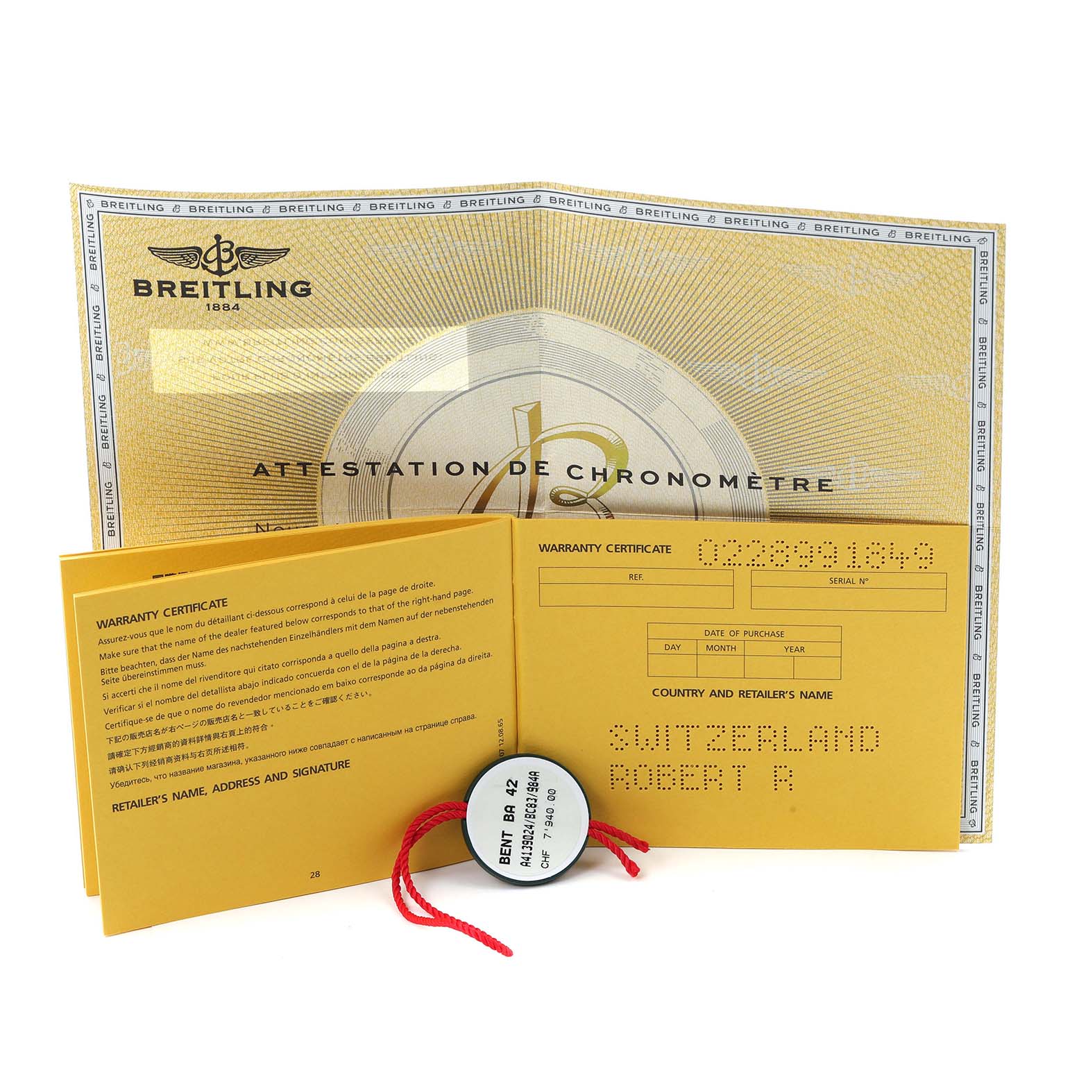 The image shows documentation for the Bentley model by Breitling, including a warranty certificate and a tag.
