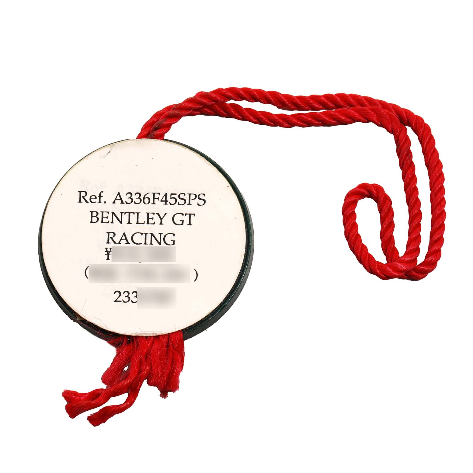 The image shows a tag for the Bentley GT Racing model by Breitling with a red string.