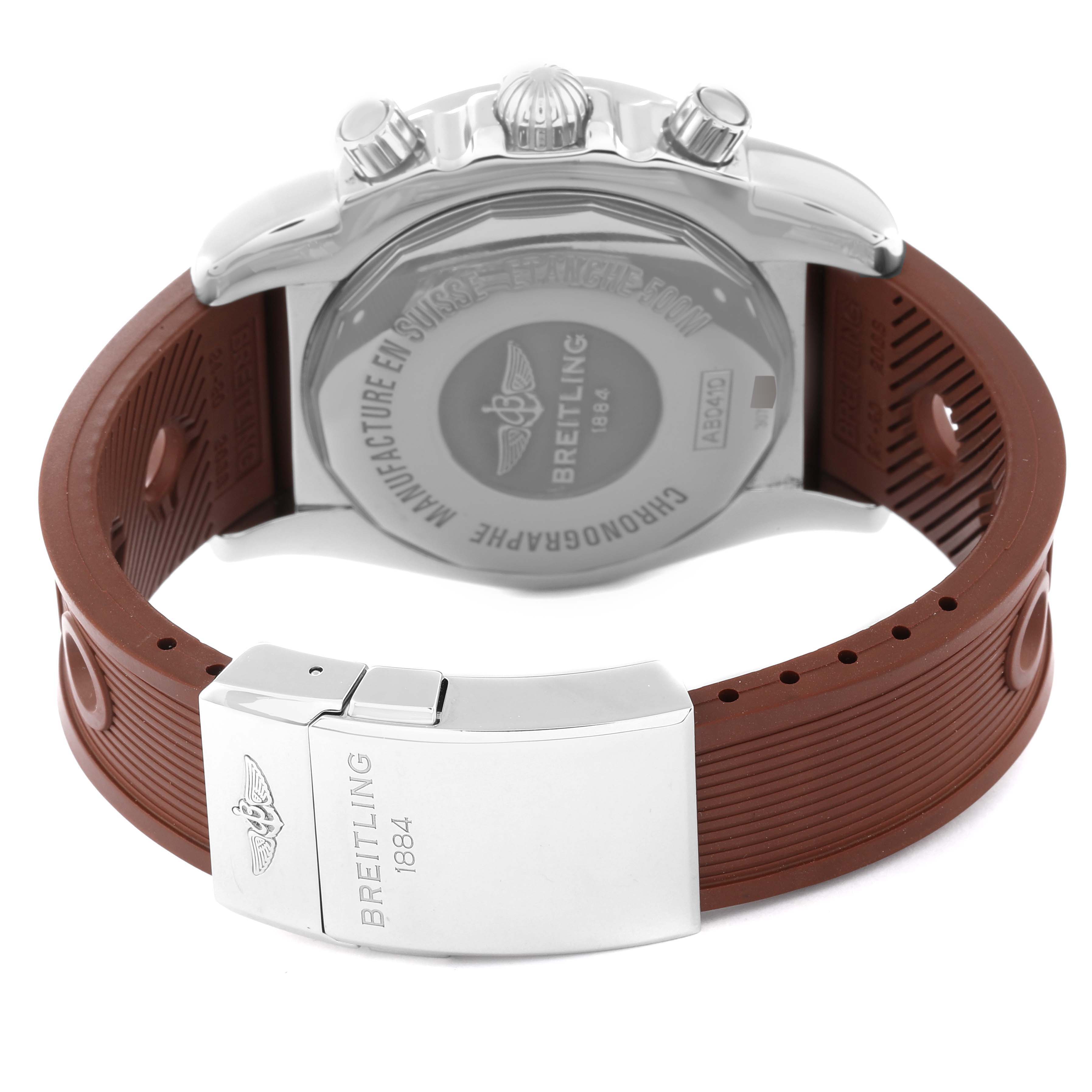 The image shows the back view of a Breitling Chronomat AB0410 Men's Stainless Steel Brown Dial AB0410 Men's Stainless Steel Brown Dial watch with its case back, brown rubber strap, and clasp visible.