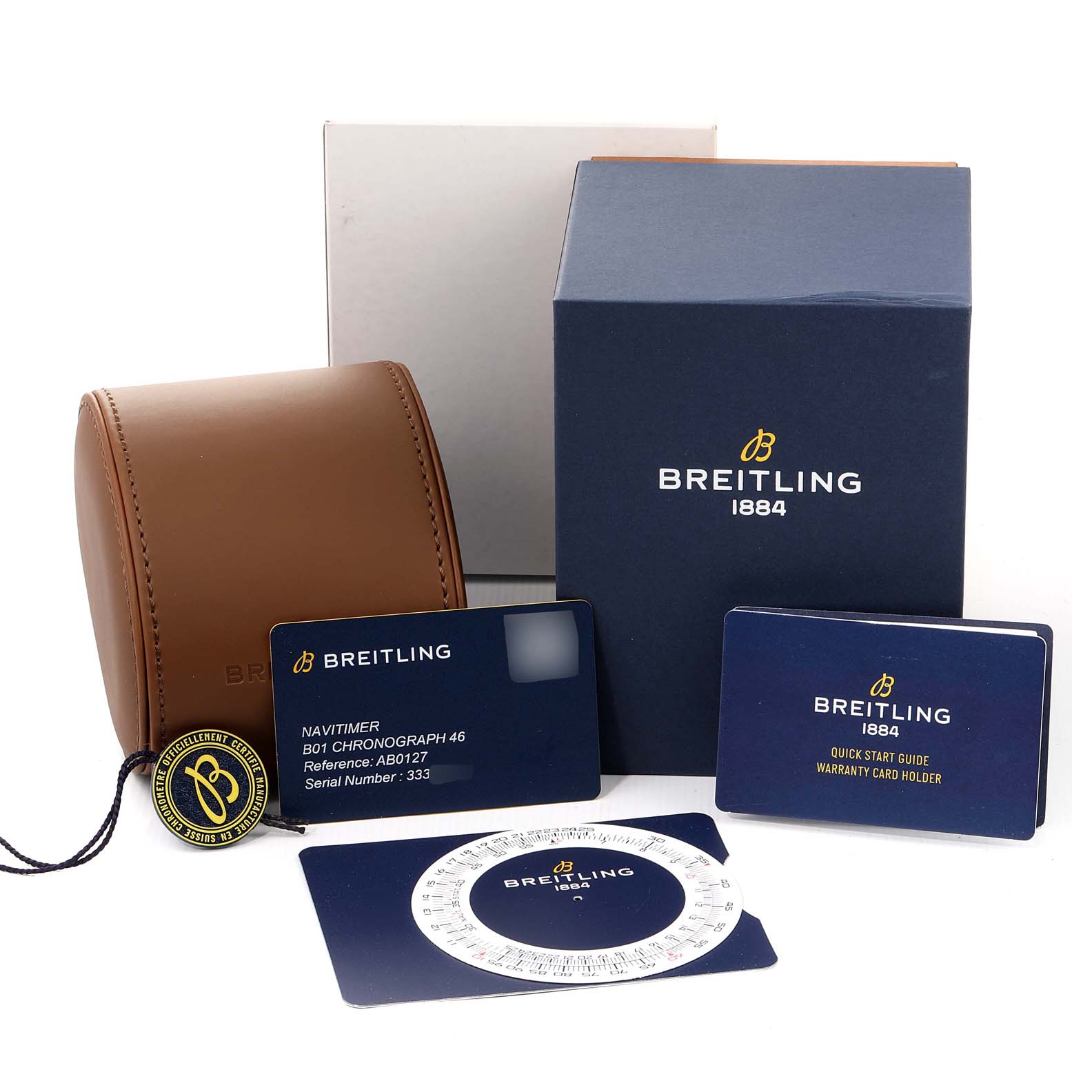 This image shows a Breitling Navitimer AB0127211C1A1 Men's Stainless Steel Black Dial AB0127211C1A1 Men's Stainless Steel Black Dial watch display box, warranty cards, a tag, and a guide.