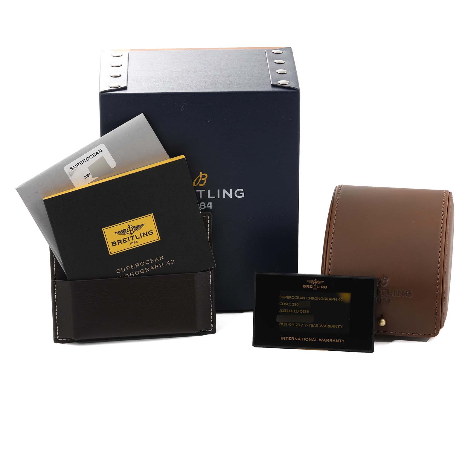 The image shows the packaging, warranty card, manual, and leather case of a Breitling Superocean A13311 Men's Stainless Steel Blue Dial A13311 Men's Stainless Steel Blue Dial watch.