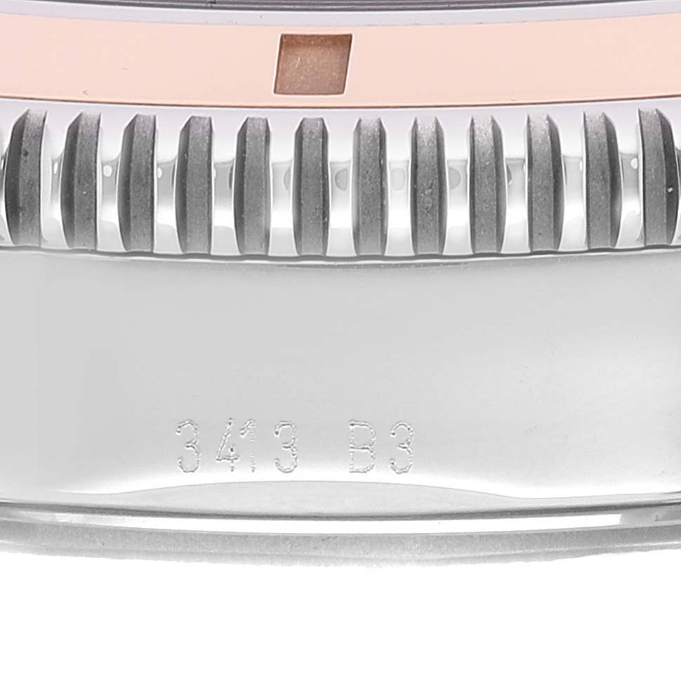 The image shows a close-up of the bezel and side casing of the Breitling Superocean U17320 Men
s Stainless Steel Black Dial U17320 Men
s Stainless Steel Black Dial watch, featuring serrated edges and engraved markings.