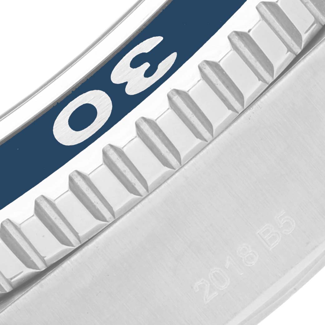 This is a close-up of the bezel and part of the casing of a Breitling Superocean A17392 Men
s Stainless Steel Blue Dial A17392 Men
s Stainless Steel Blue Dial watch, showing the "30" minute marker and the knurled bezel edge.