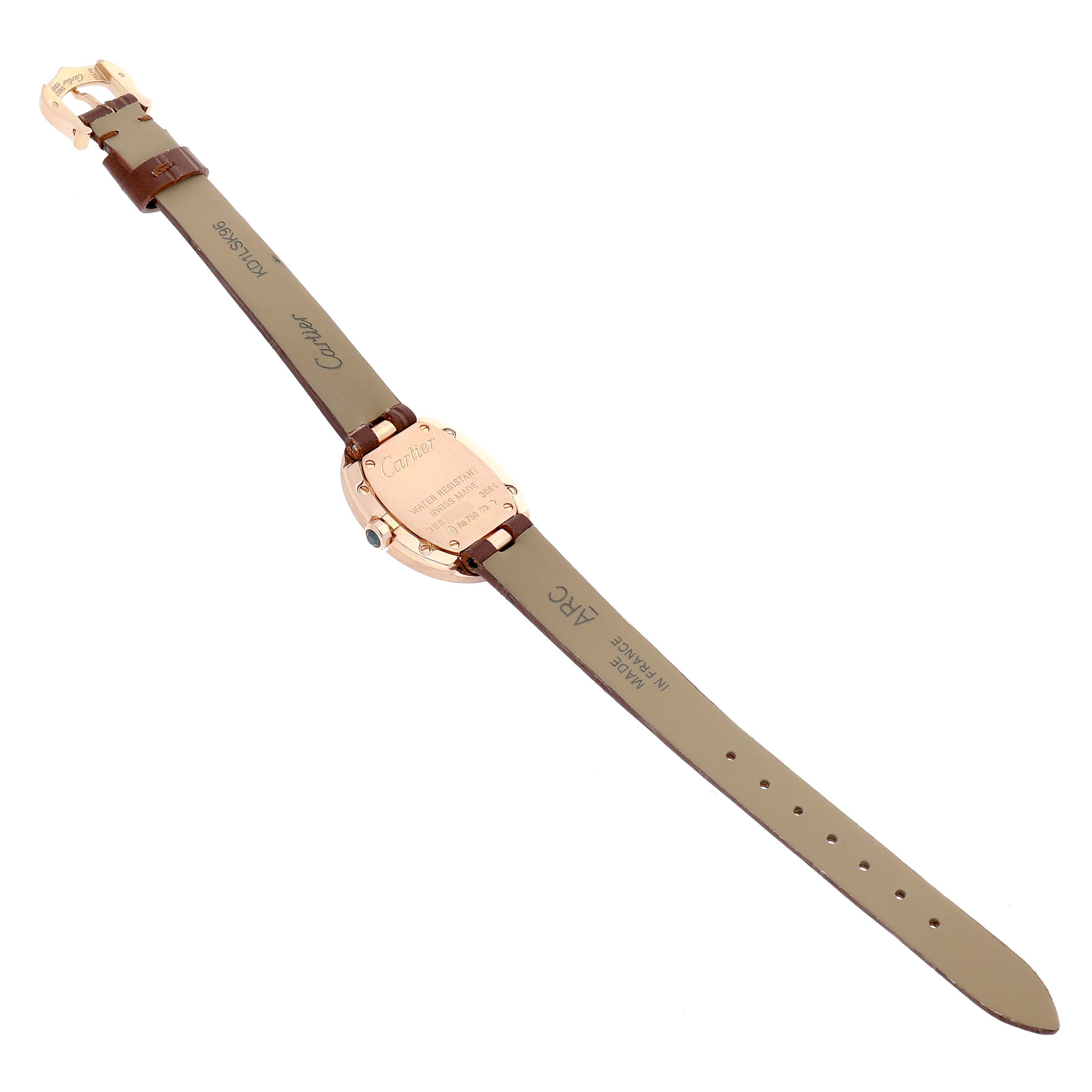 The image shows the back view of a Cartier Baignoire W8000007 Women's Rose Gold Silver Dial watch, highlighting the case back and brown strap details.