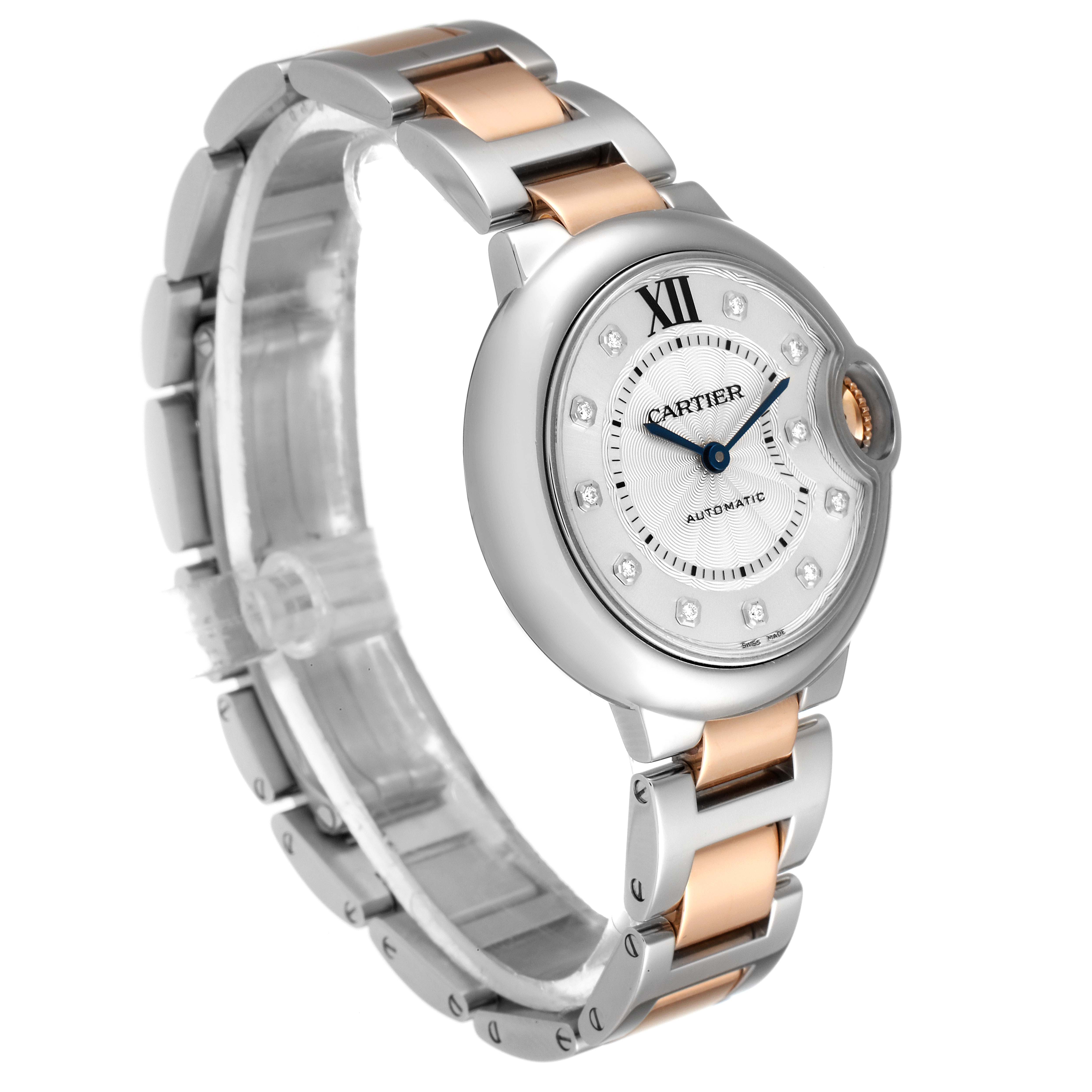 The image shows a side-angle view of a Cartier Ballon Bleu WE902061 Women's Steel and Gold (two tone) Silver Dial WE902061 Women's Steel and Gold (two tone) Silver Dial watch, highlighting the face, bezel, crown, and two-tone metal bracelet.