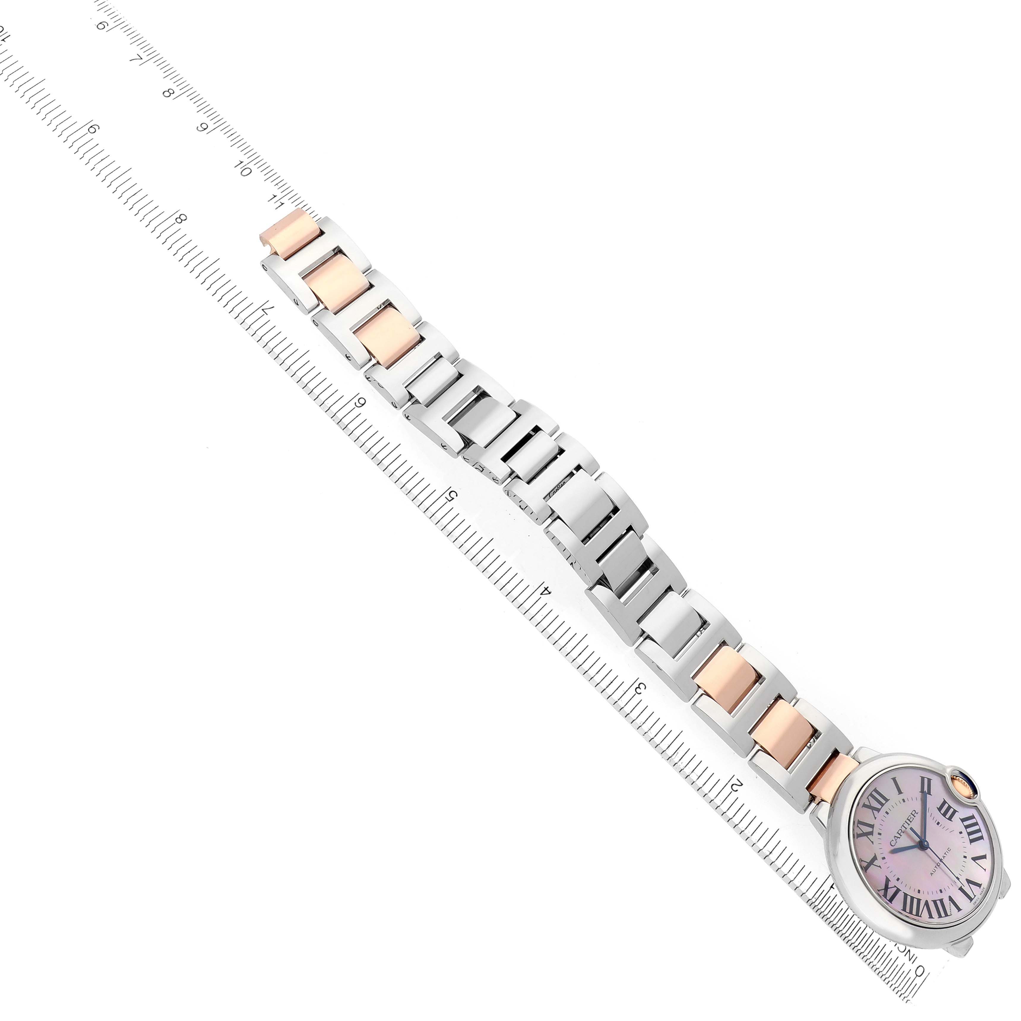 The Cartier Ballon Bleu W6920033 Women
s Stainless Steel Mother of Pearl Dial watch is shown in a top-down angle, displaying the full bracelet with a mix of silver and rose gold links.