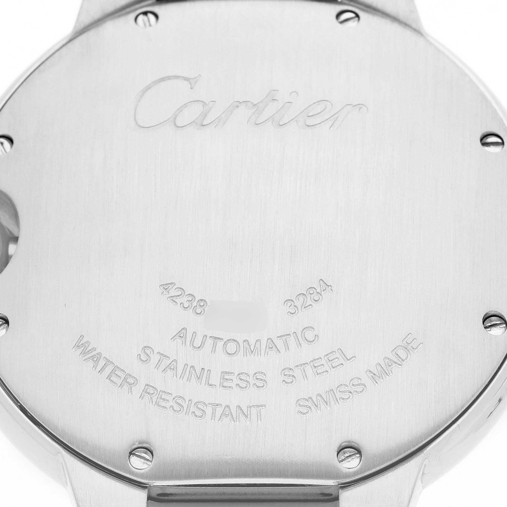 The image shows the back of a Cartier Ballon Bleu W6920033 Women
s Stainless Steel Mother of Pearl Dial watch with engraved details on its stainless steel surface.