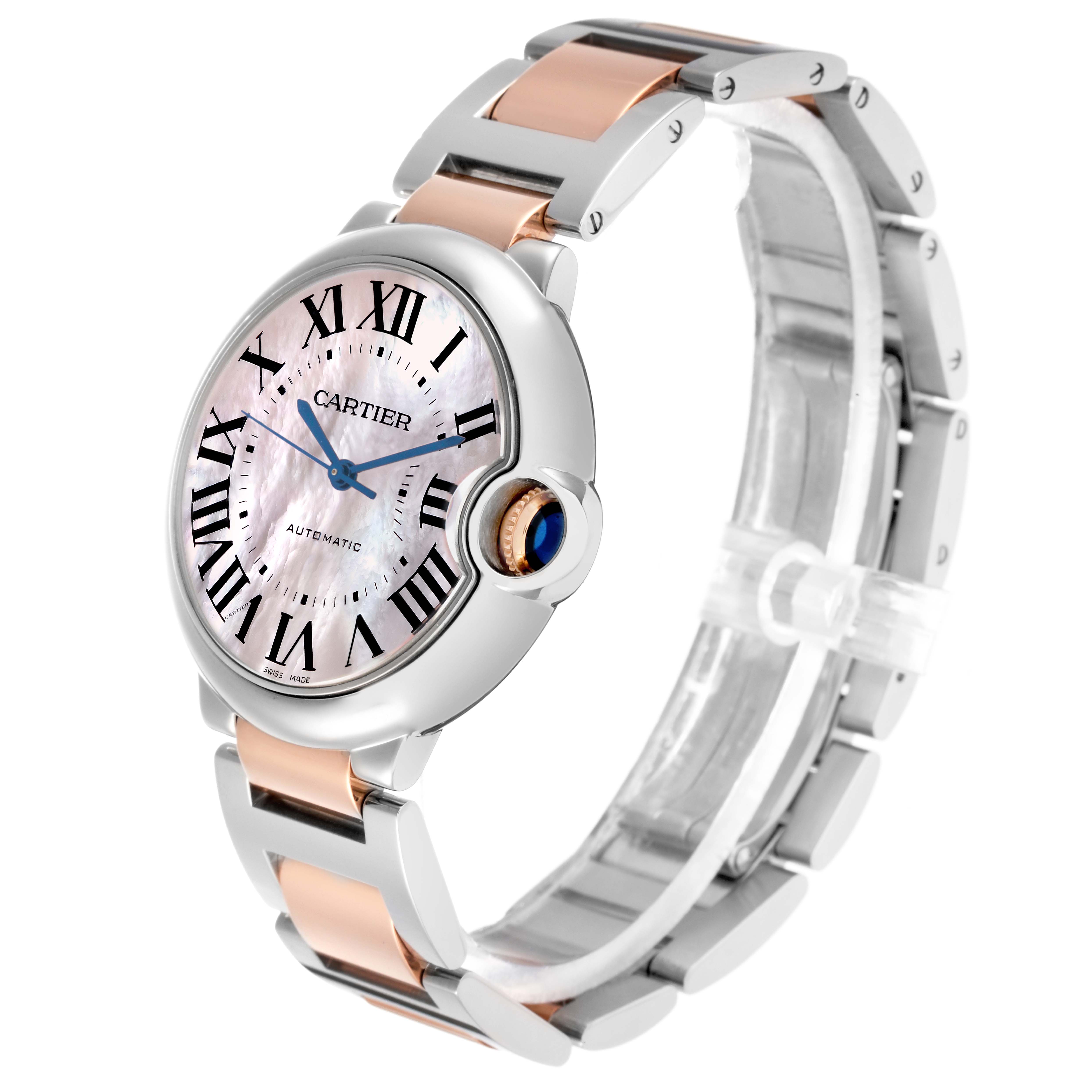The Cartier Ballon Bleu W6920033 Women
s Stainless Steel Mother of Pearl Dial watch is shown from a front-side angle, highlighting the face, bezel, and two-tone bracelet.
