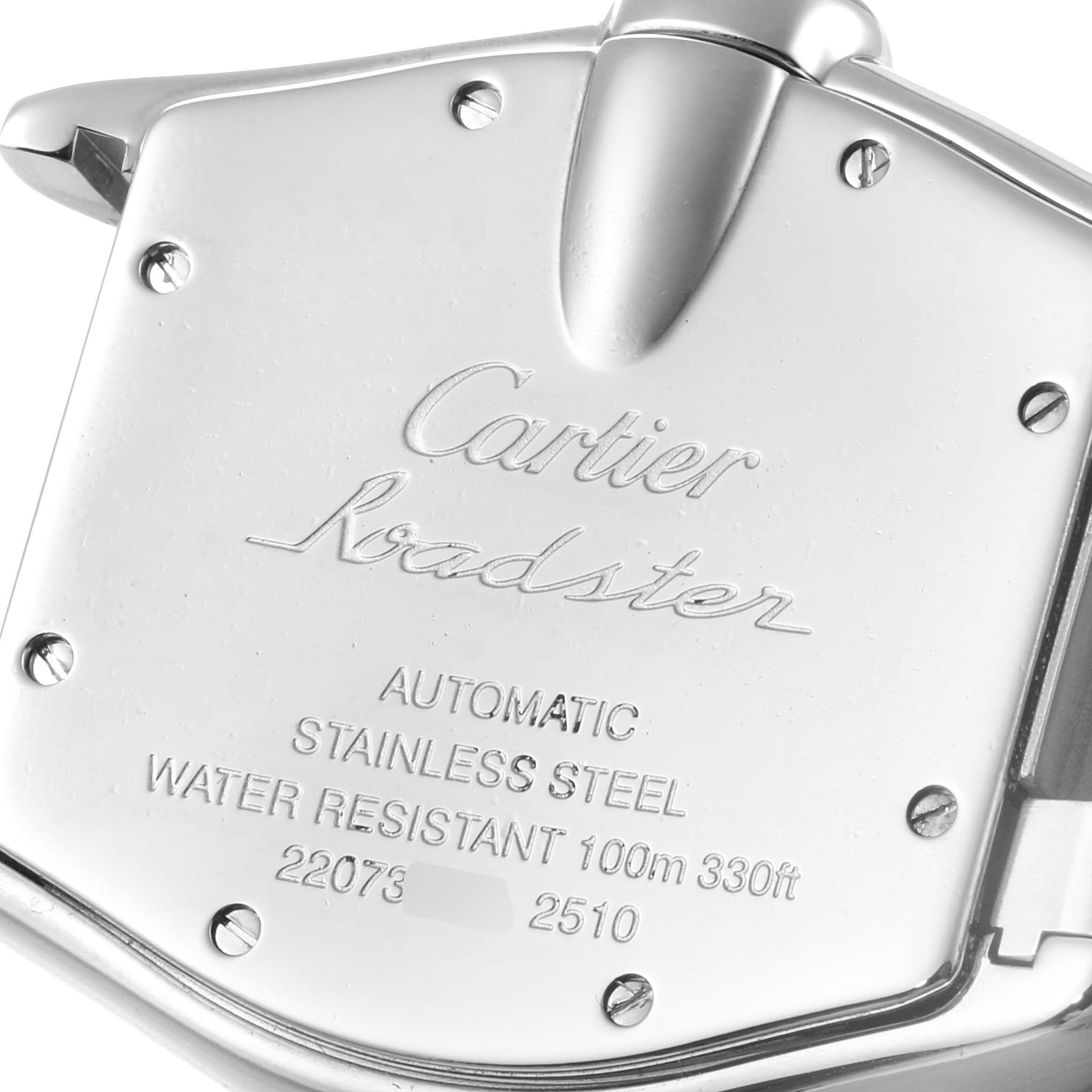 The image shows the back casing of the Cartier Roadster W62025V3 Men
s Stainless Steel Silver Dial W62025V3 Men
s Stainless Steel Silver Dial watch, highlighting its inscriptions and screws.
