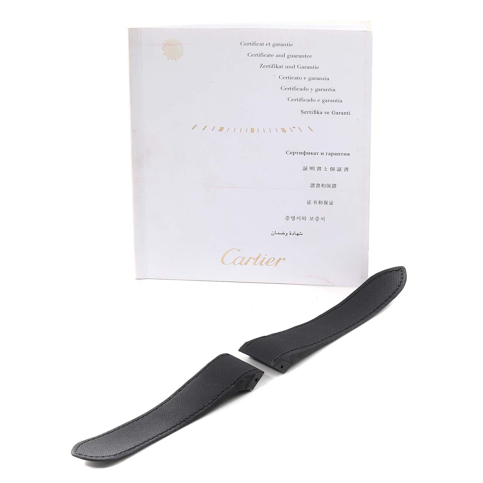 The image shows a pair of black leather straps for a Santos model by Cartier, placed in front of a certificate and guarantee document.