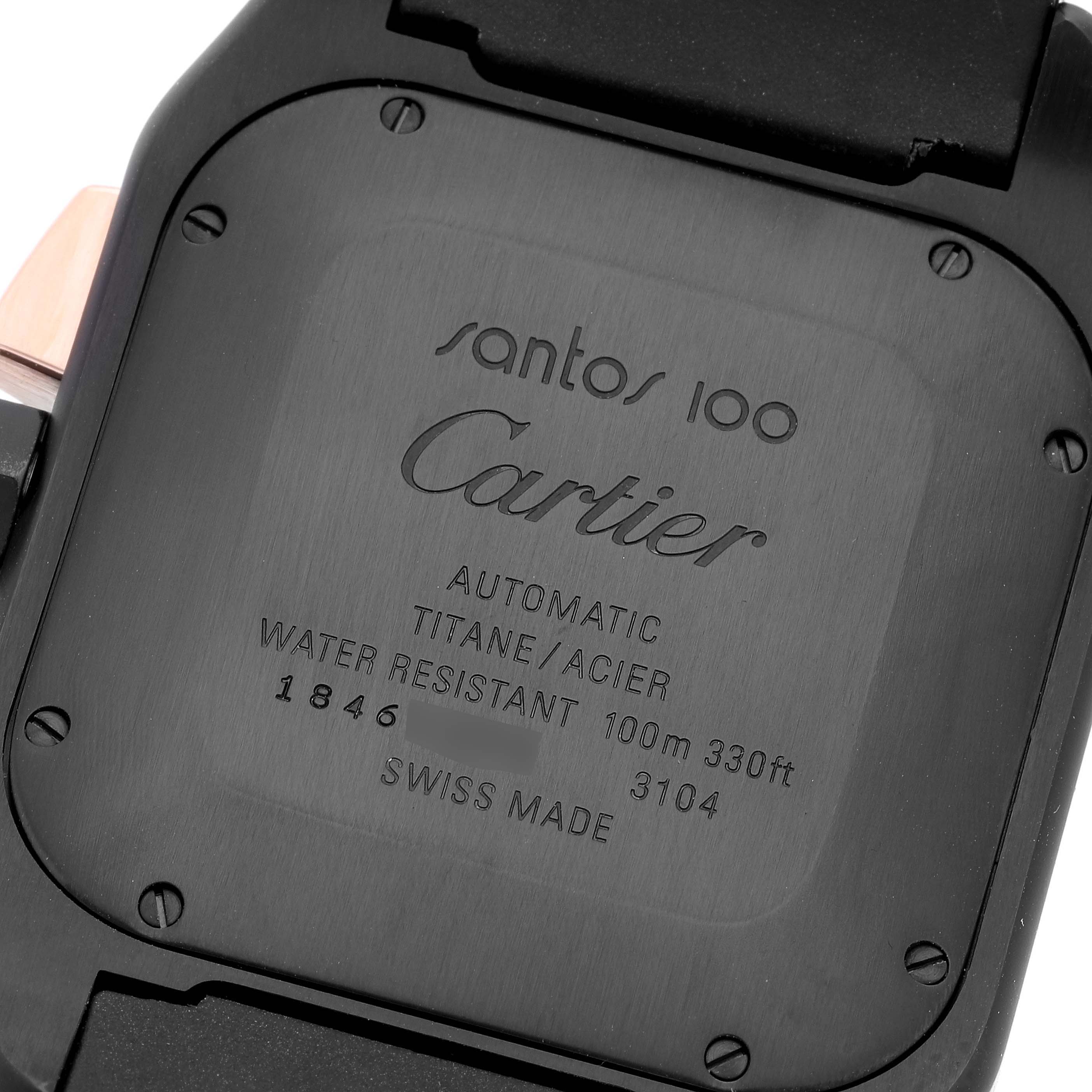 The image shows the back case of a Santos 100 watch by Cartier, highlighting its engravings and screw details.
