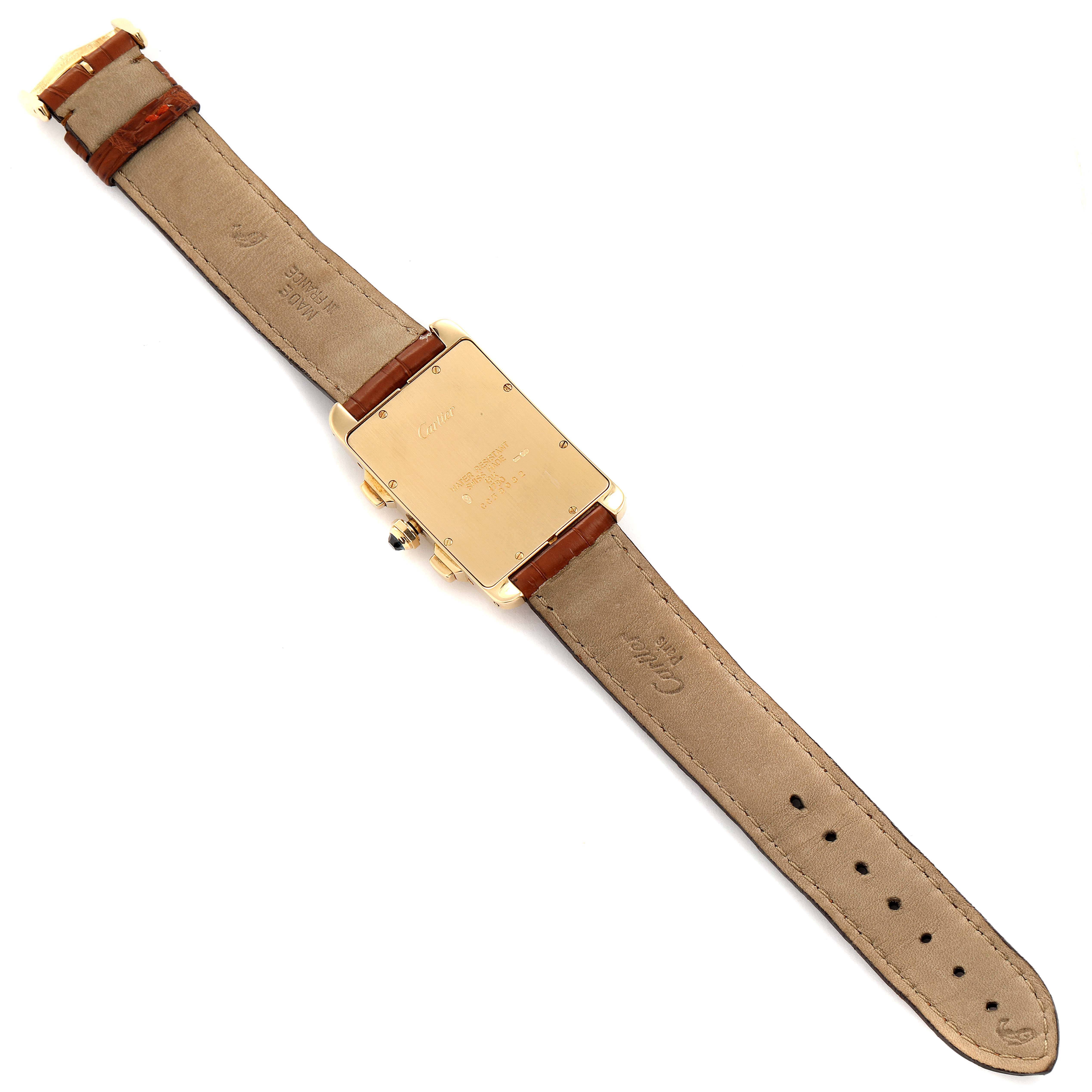 The image shows a Cartier Tank Américaine watch from the back, displaying the case back and leather strap.