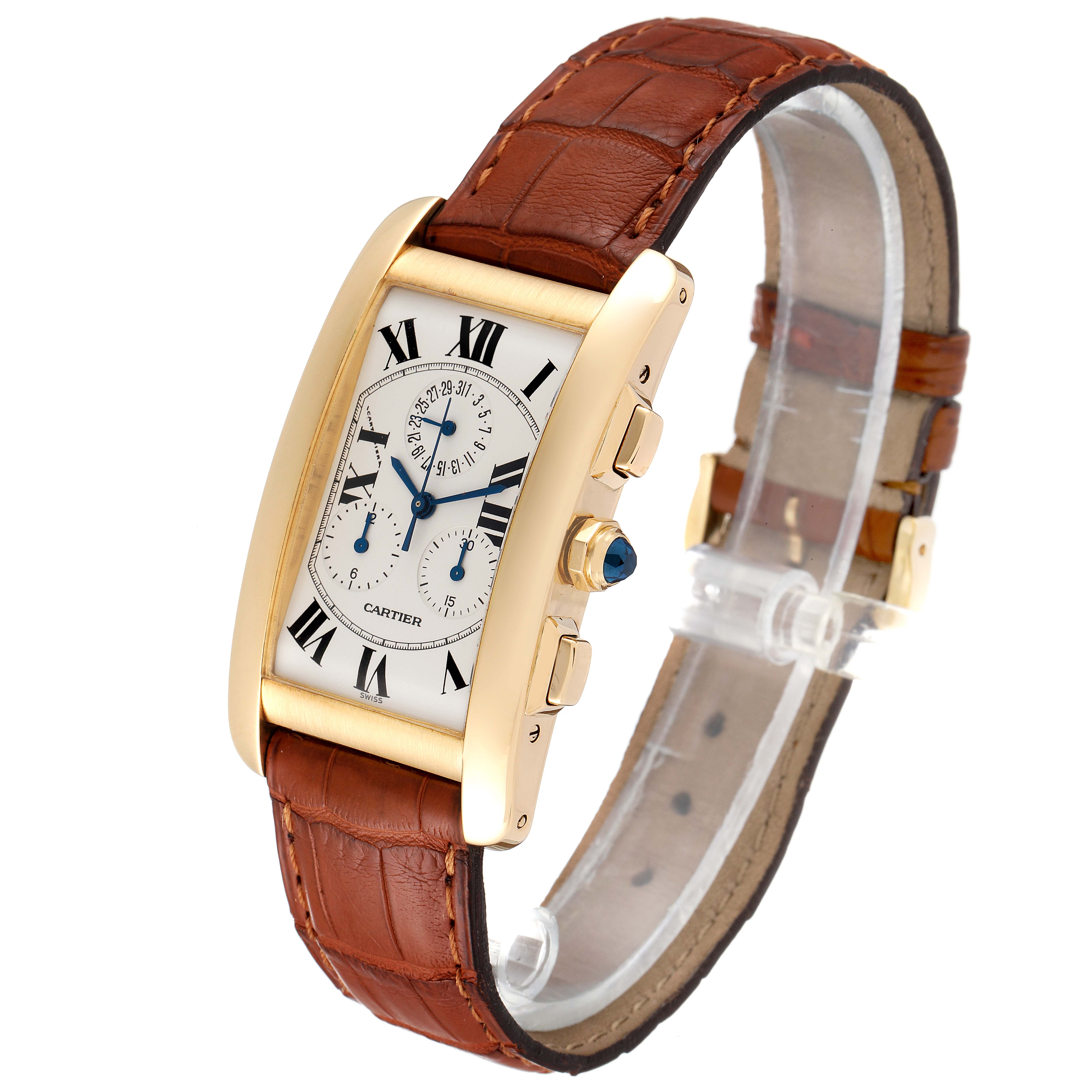 The Cartier Tank Americaine W2601156 Men's Yellow Gold Silver Dial W2601156 Men's Yellow Gold Silver Dial watch is shown at an angle highlighting its gold case, roman numeral dial, brown leather strap, and side buttons.