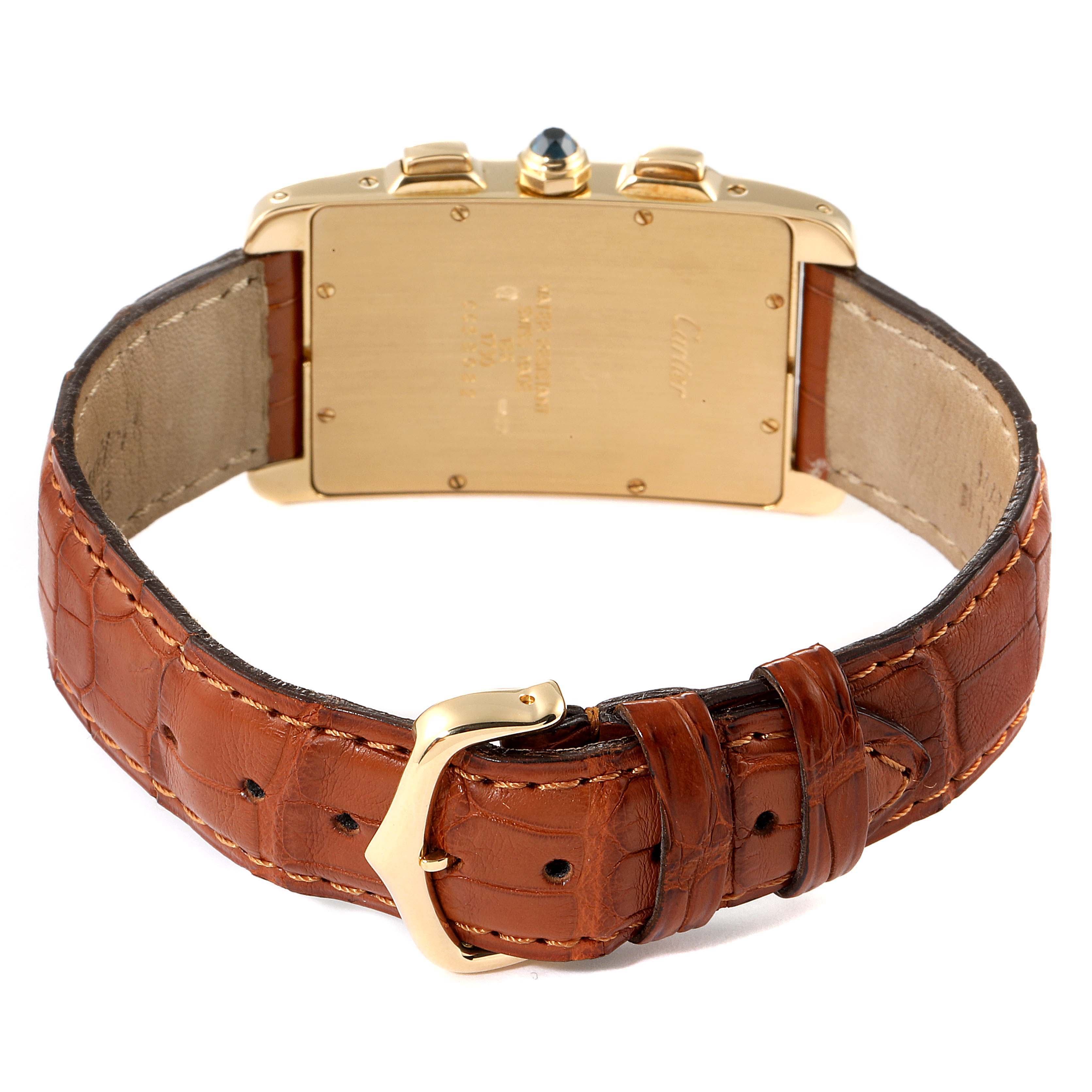 This image shows the back view of a Cartier Tank Américaine watch, highlighting its case back, crown, and leather strap with a buckle.