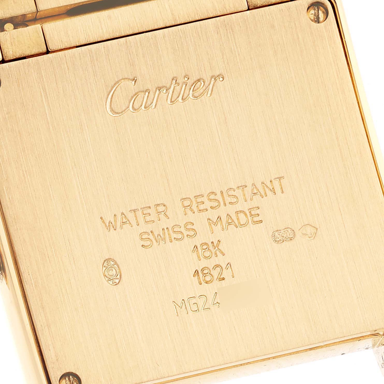 This image shows the back case of a Cartier Tank Française watch, highlighting its inscriptions and screws.