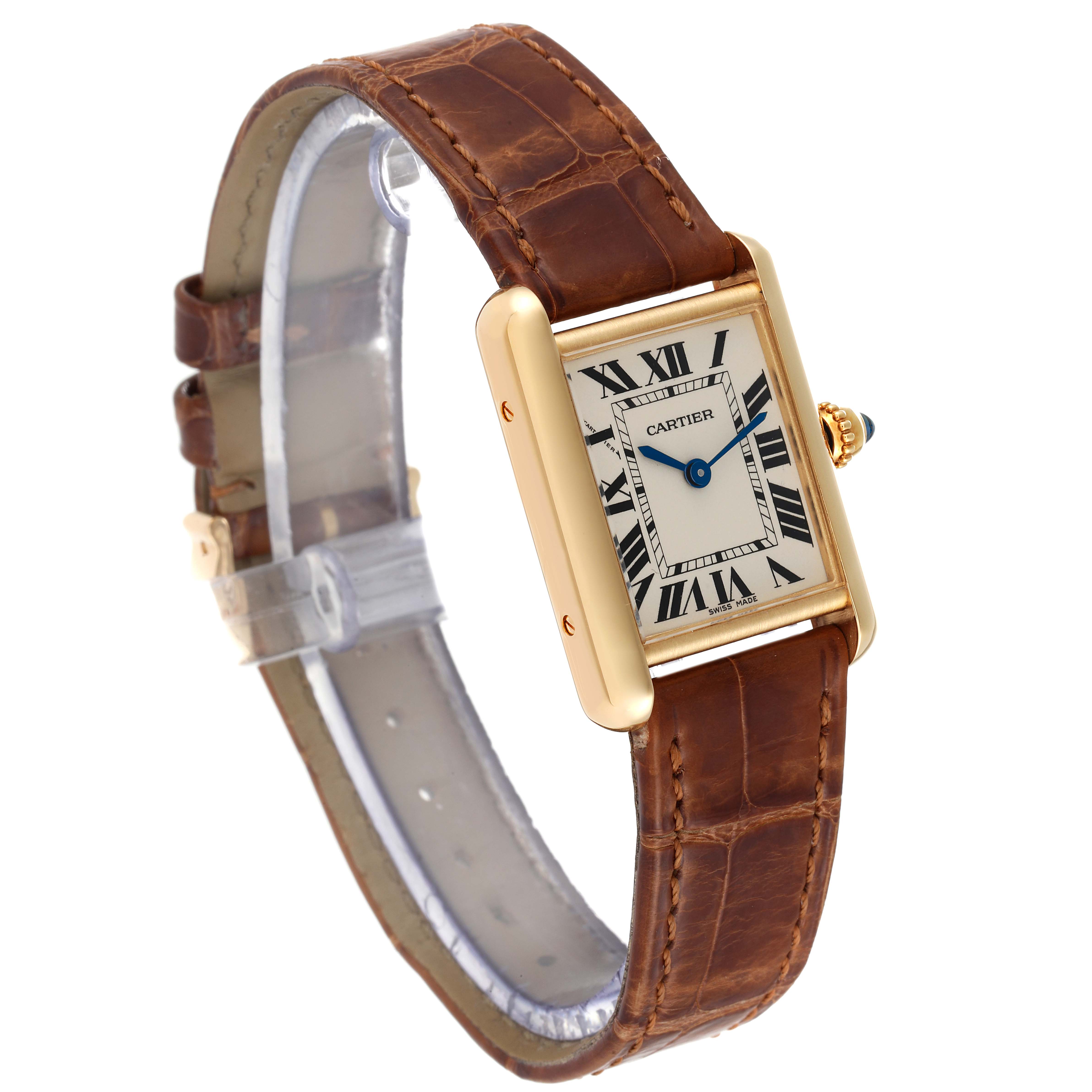 The Tank Louis Cartier watch is shown at a three-quarter angle, highlighting its rectangular dial, gold case, and brown leather strap.