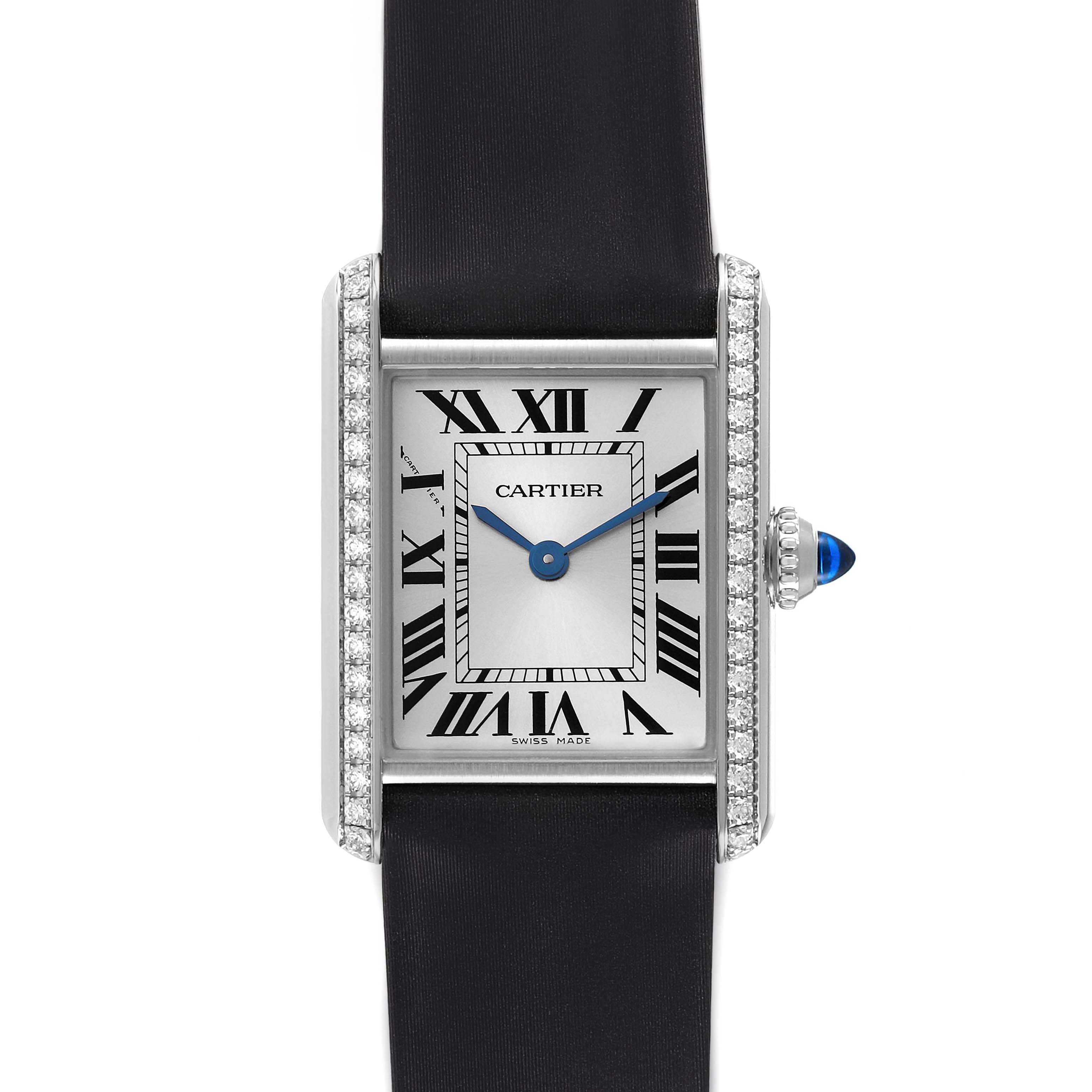 The image shows a frontal view of the Cartier Tank Must W4TA0016 Women's Stainless Steel Silver Dial W4TA0016 Women's Stainless Steel Silver Dial watch, displaying its face, diamond-set case, and black strap.