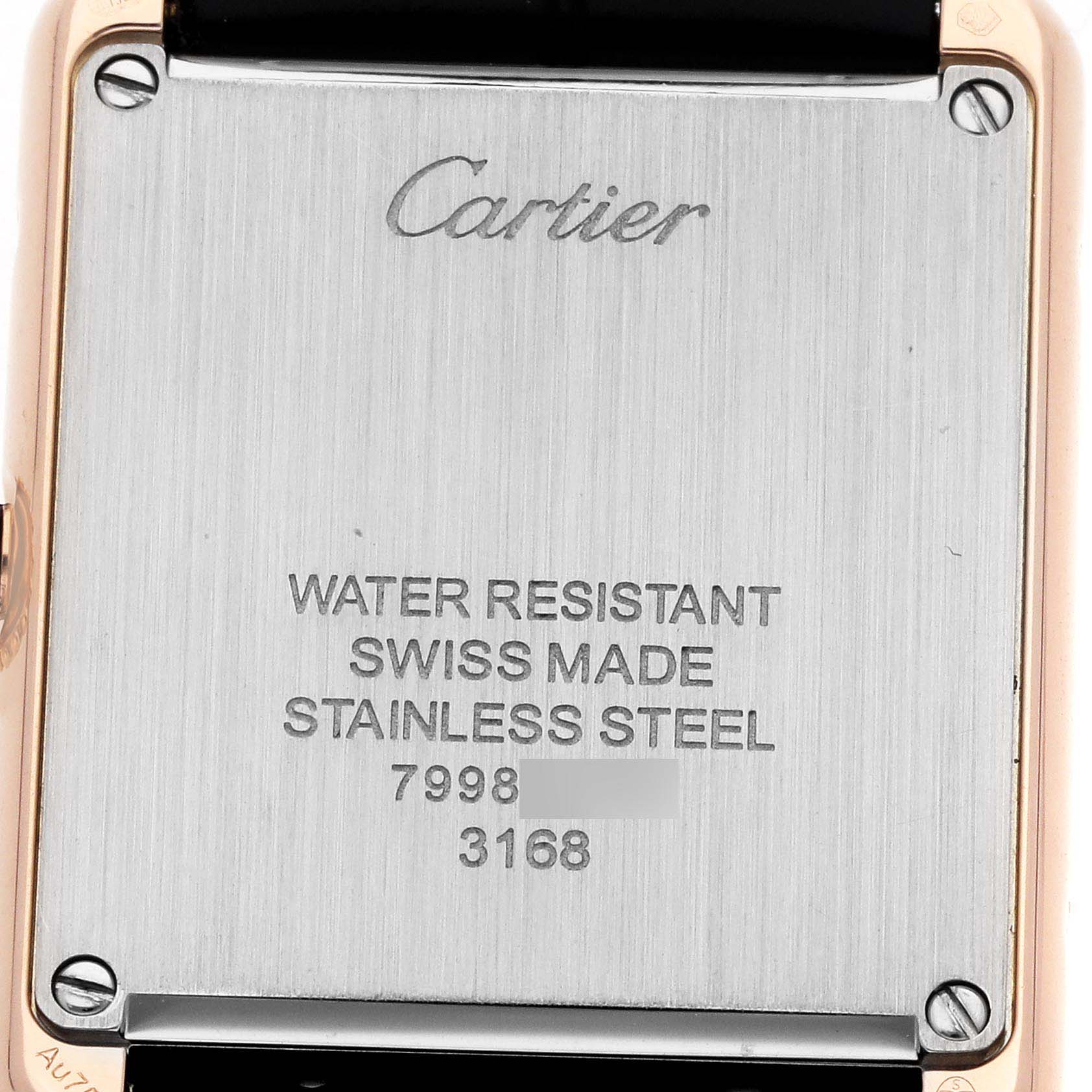 The image shows the back case of a Cartier Tank Solo W5200002 Women
s Steel and Gold (two tone) Silver Dial watch, displaying its branding and specifications.