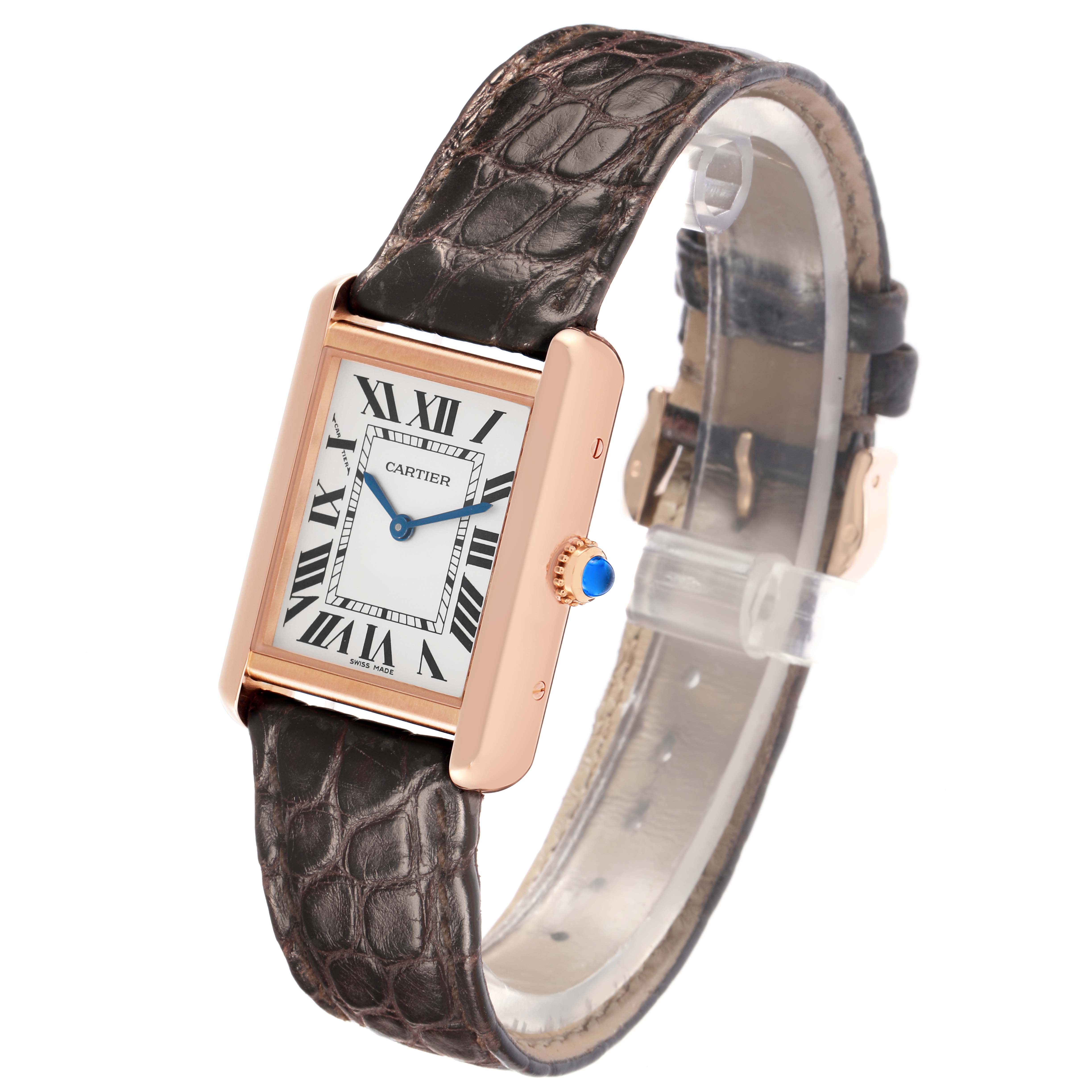 The Cartier Tank Solo W5200024 Women
s Rose Gold Silver Dial is shown at a slight angle, displaying its rectangular face, Roman numerals, blue hands, and leather strap.