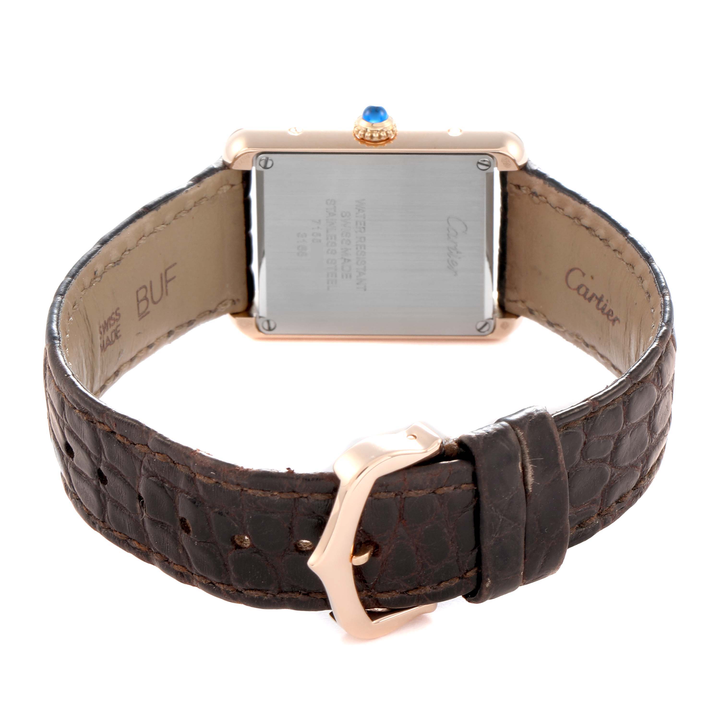 The image shows the Cartier Tank Solo W5200024 Women
s Rose Gold Silver Dial watch from the back, highlighting the case back, crown, leather strap, and buckle.