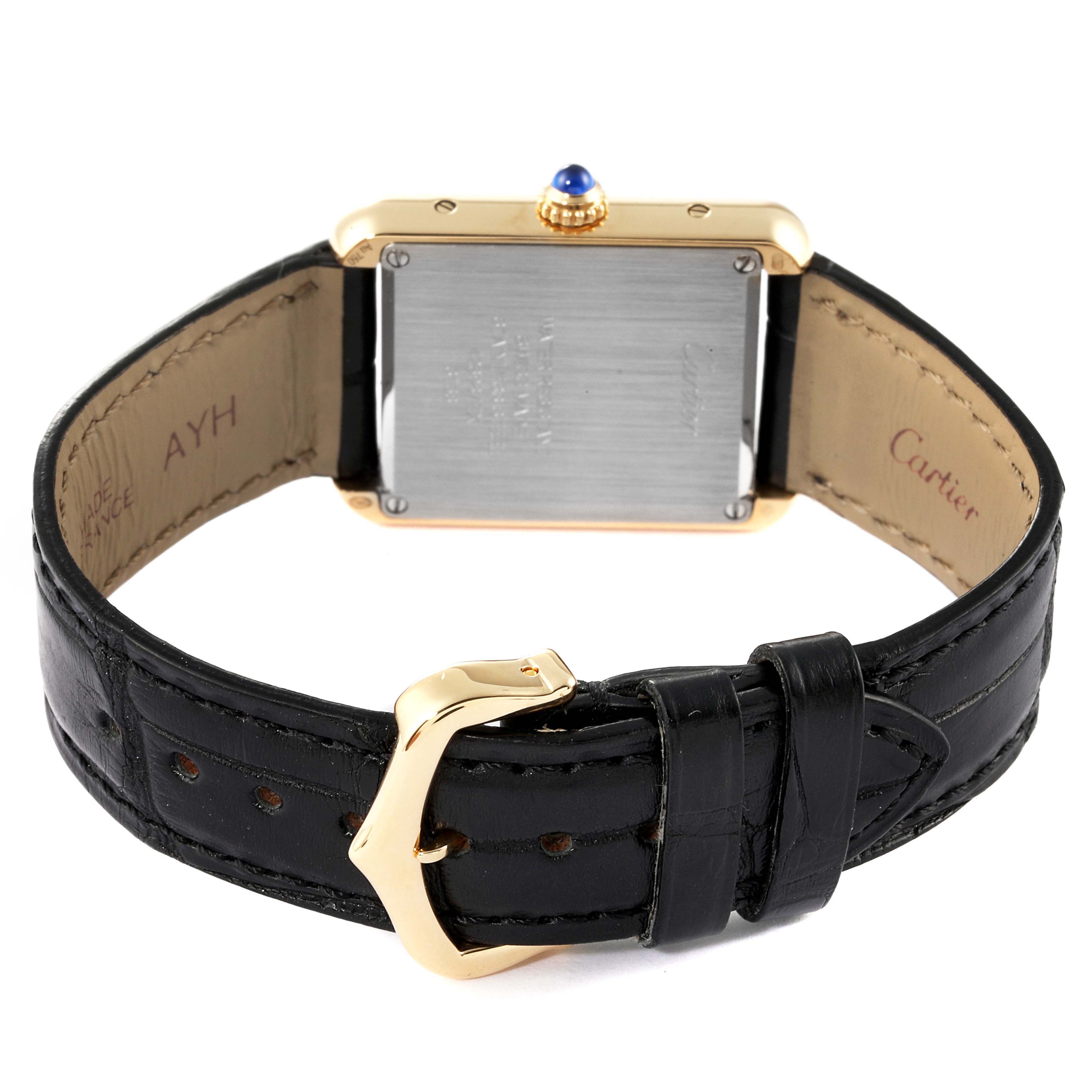 The image shows the back case, crown, and black leather strap with a buckle of the Cartier Tank Solo W5200002 Women's Yellow Gold Silver Dial W5200002 Women's Yellow Gold Silver Dial watch.